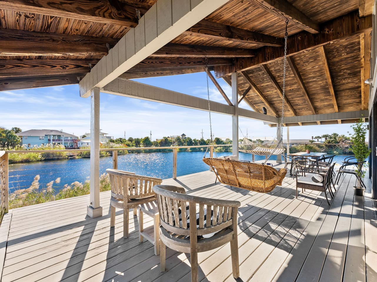 Cozy up for morning coffee and sunset margaritas on this stunning balcony overlooking the lake.