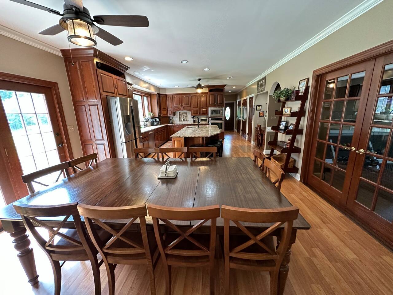 Enjoy eating at this spacious area with a large 10ftx5ft table that fits 12  people (1 chair not shown). Additional seating at the kitchen island, and a pull-up coffee table in the family room. Ceilings are 9ft.