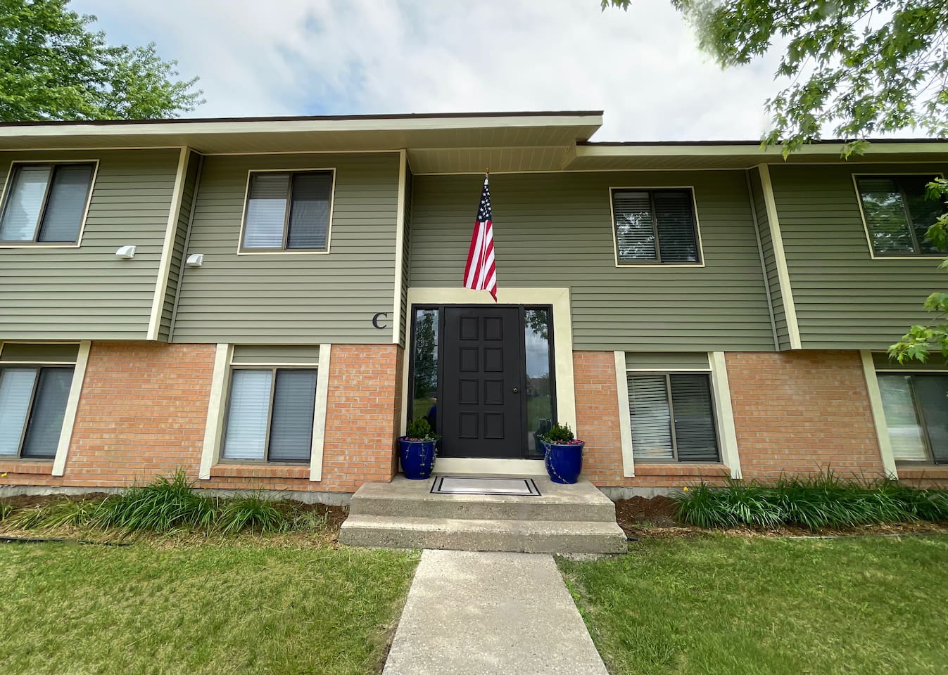 Welcome to your home away from home! This well-kept building features easy entry, a charming front porch with planters, and a peaceful setting surrounded by nature—perfect for a relaxing, private stay with convenient access to all the essentials.