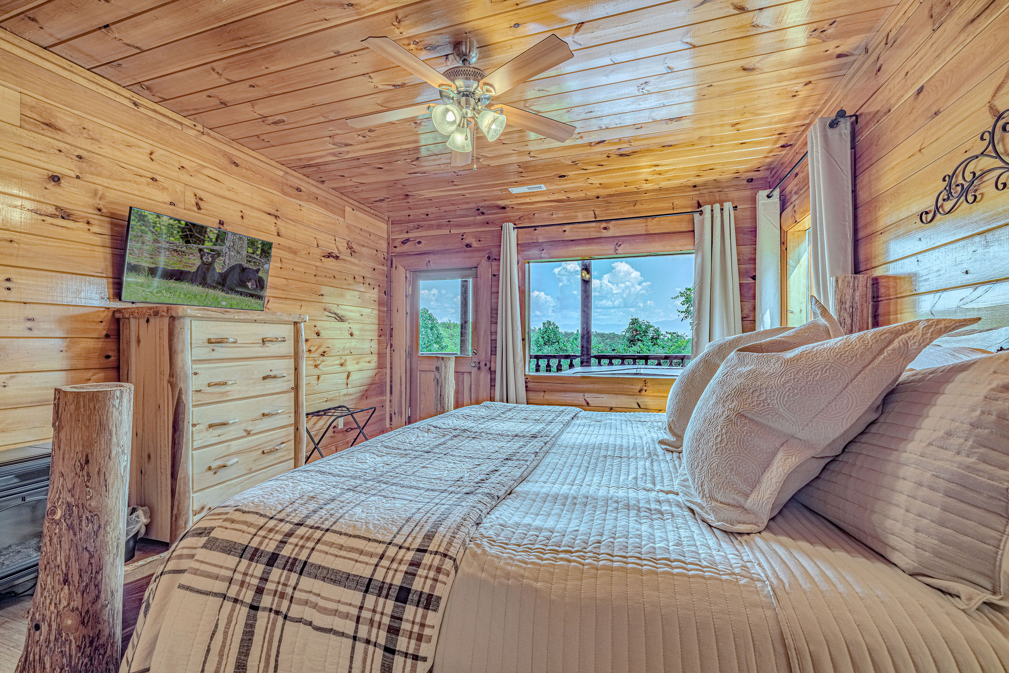 Spacious primary King suite with windows that bring the outdoors in.