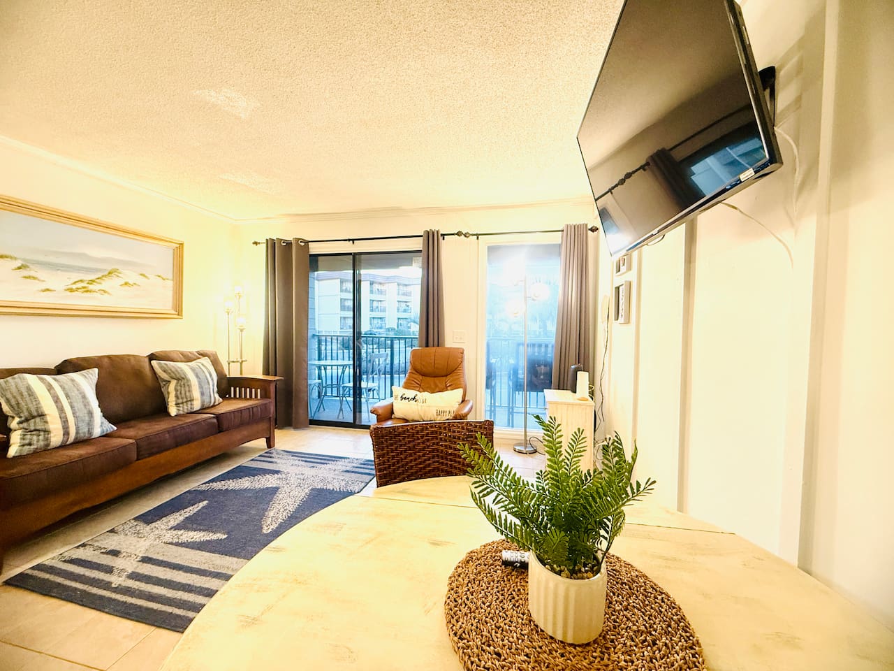 Living and dining area with balcony doors