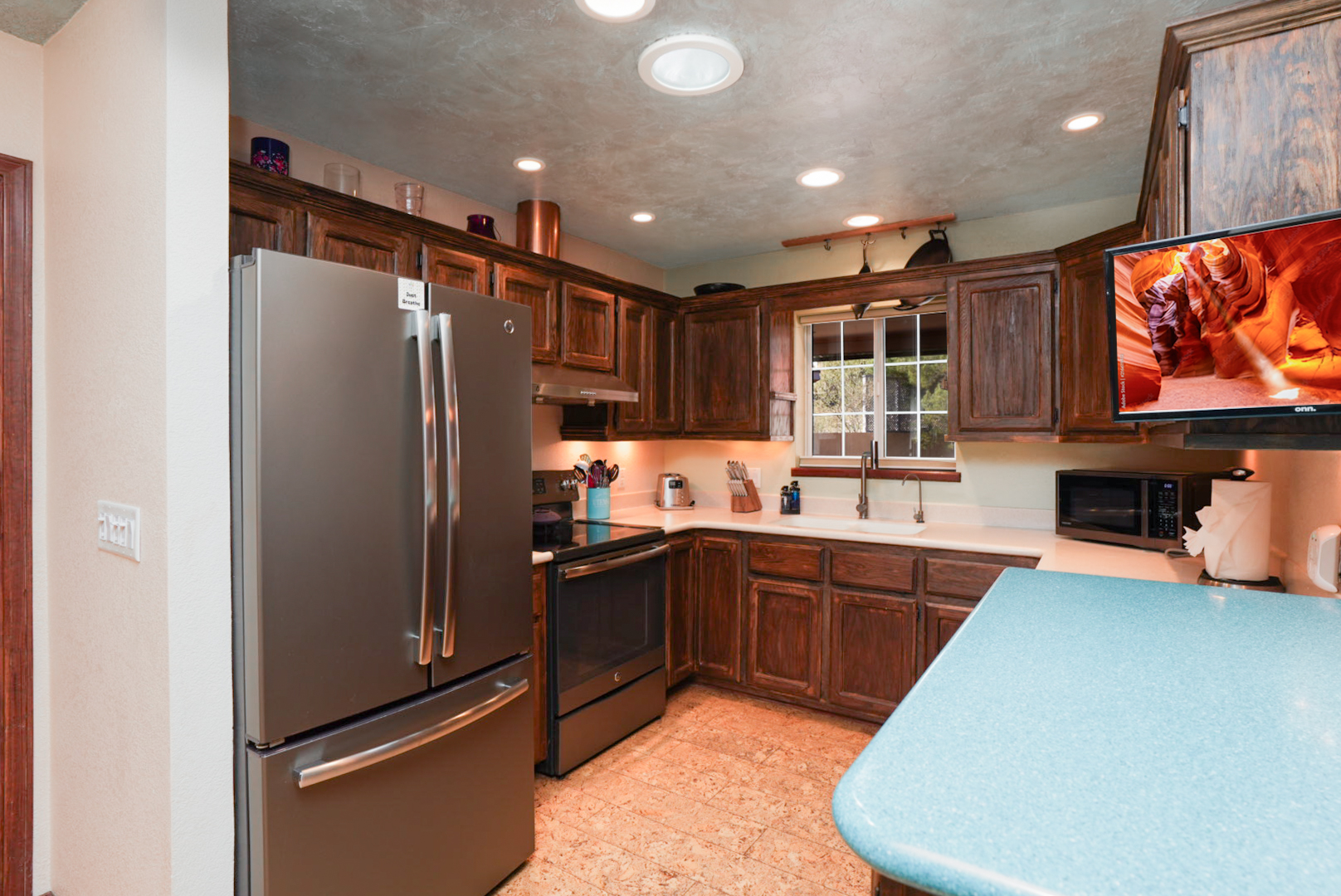 Fully equipped kitchen with stainless steel appliances, ample counter space, and everything you need to prepare meals at home.