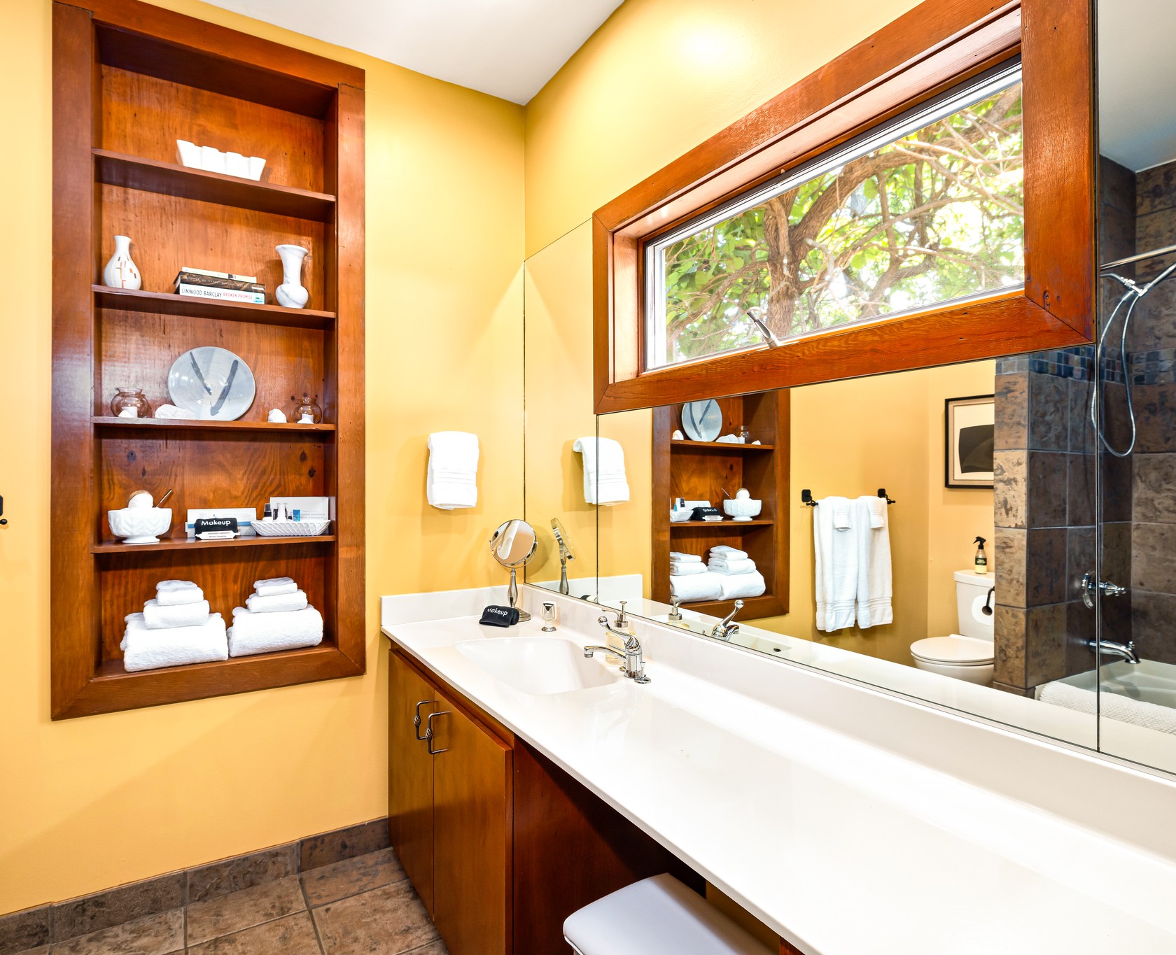 Spacious Skyview en-suite bath is the largest lower floor bathroom with space for two to get ready at once. Watch wild birds out the privacy height window! Drawers for storage and plentiful towels.