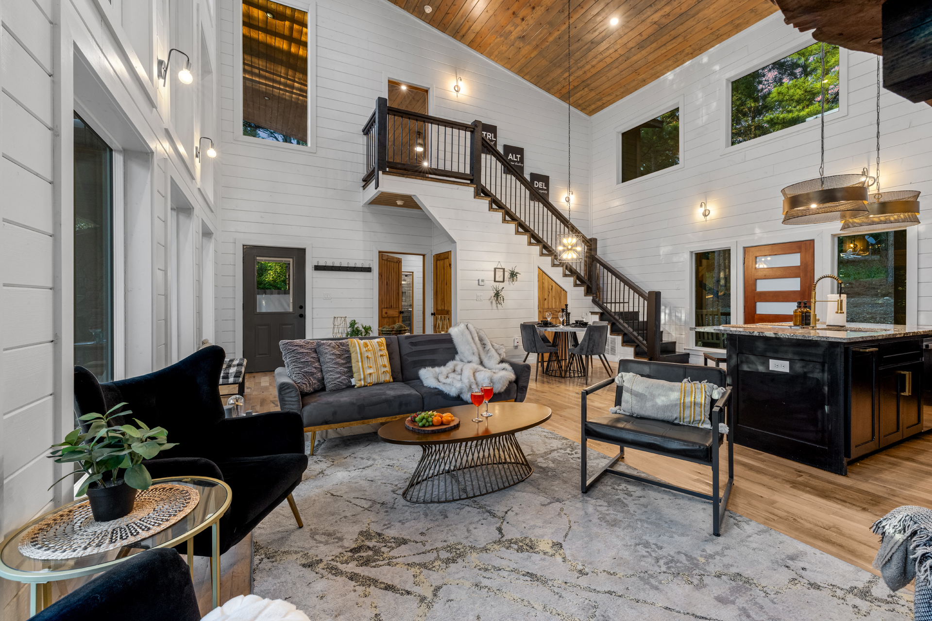 Comfortable central lounge made for downtime, featuring seating, fireplace, and screen.