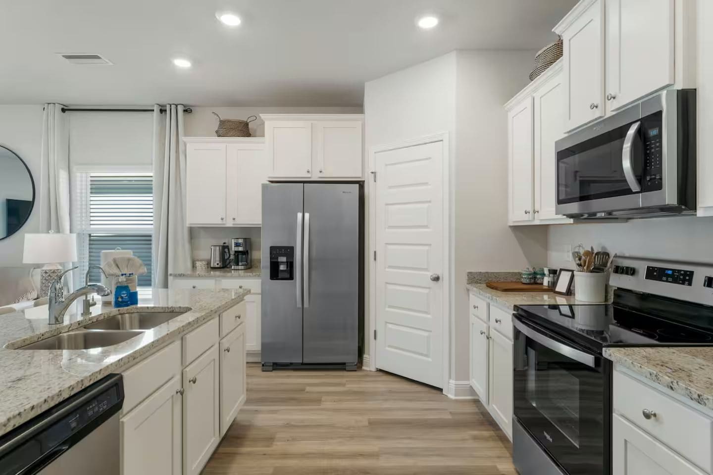 Spacious kitchen featuring counter seating, a 2-door fridge, and full cooking essentials.