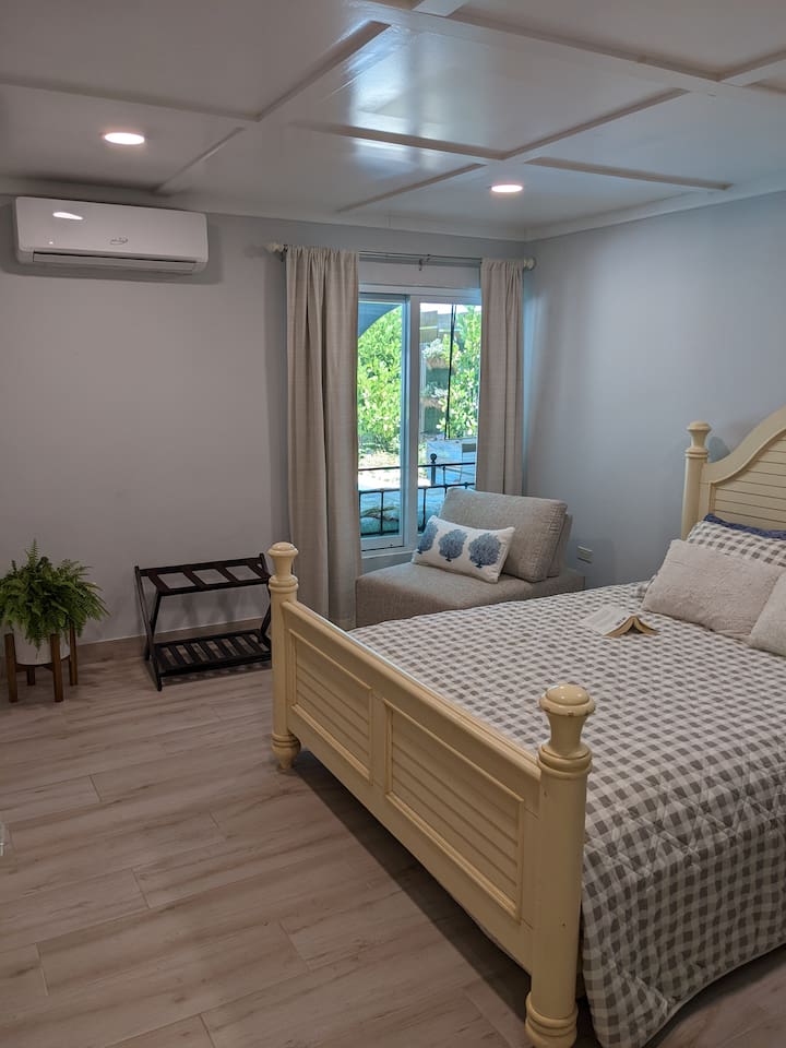 Here is the view of the 2nd bedroom from the door. Comfy chair that looks out at the pool if you want to relax with a book.