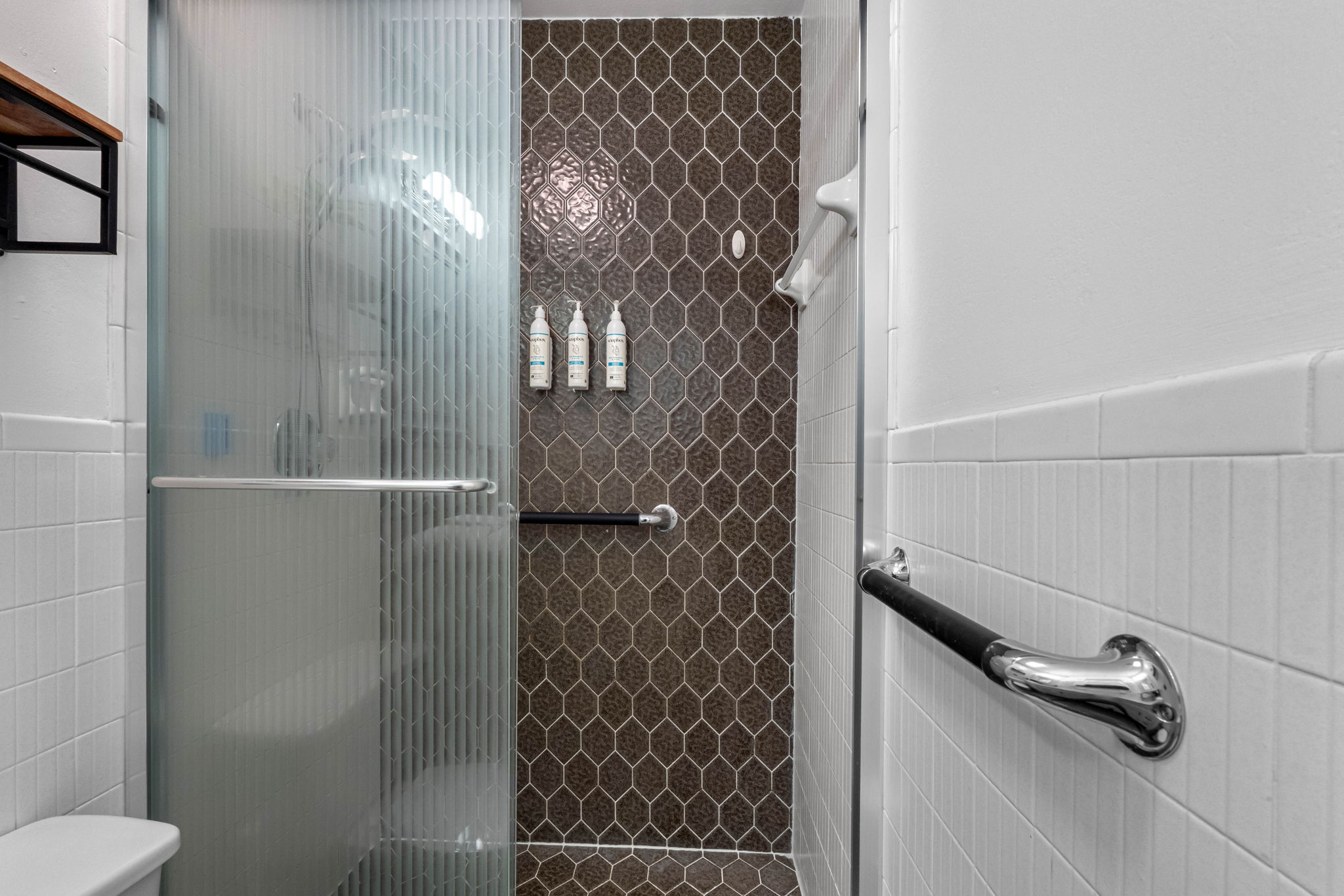 With a walk-in shower, ample storage, and updated fixtures, this bathroom is designed for both style and convenience.