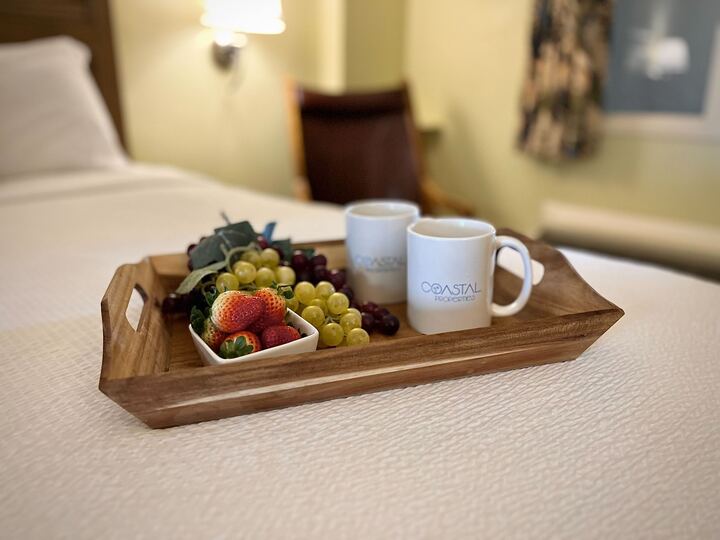 Relax in comfort with soft linens and a calm coastal vibe