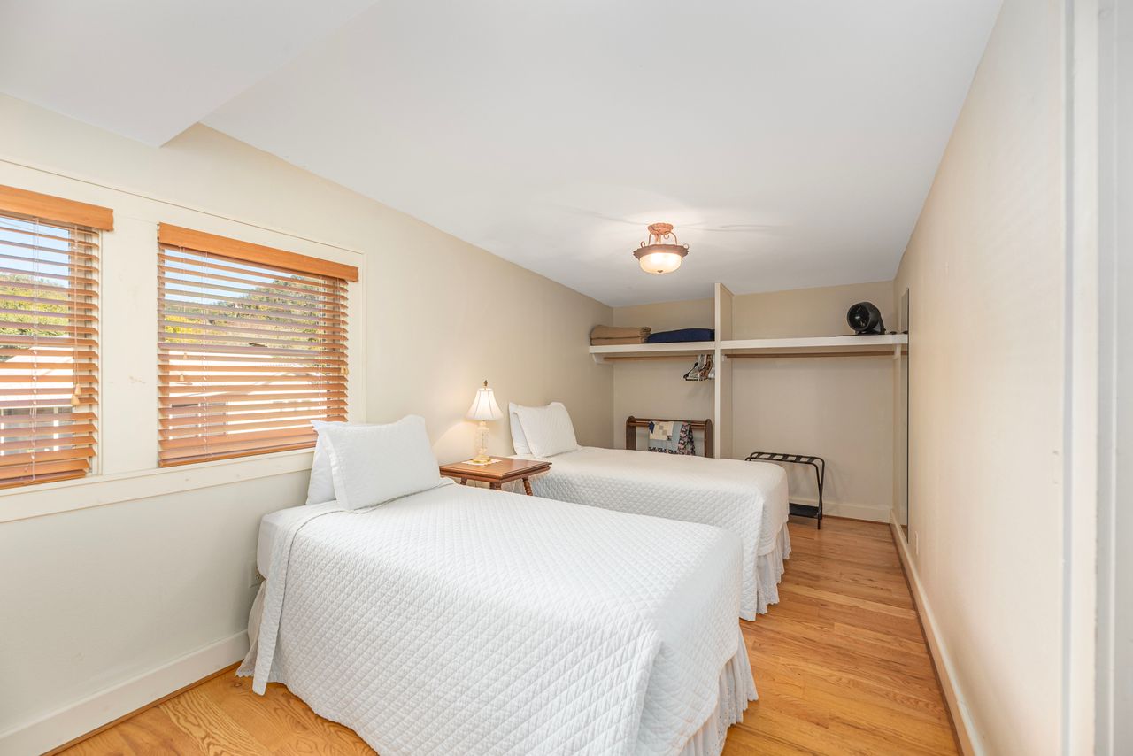 This technically is a room of its own with two twin beds, but there is acurtained doorway between the two spaces. 