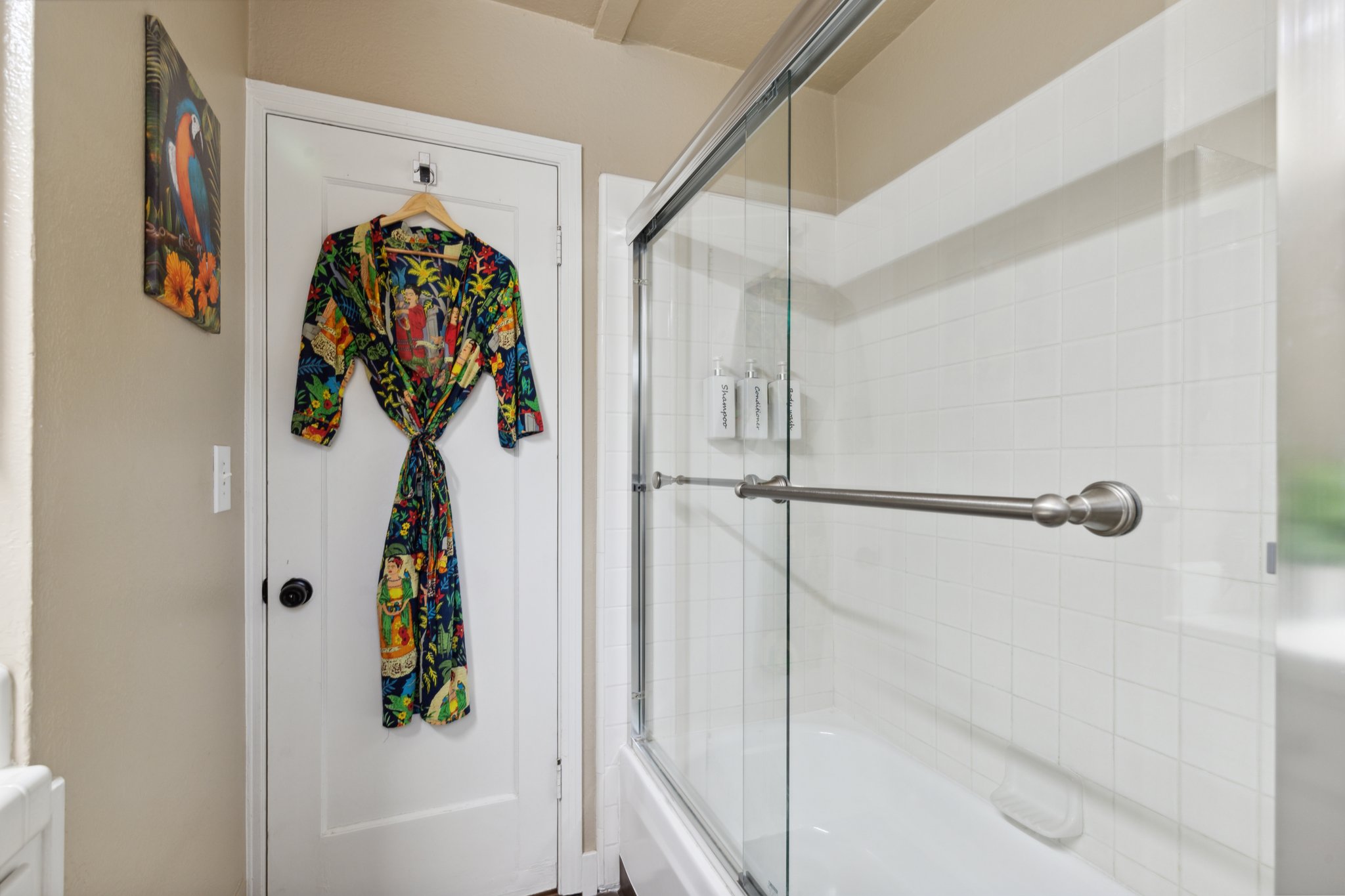 Bathroom stocked with essentials and robe.