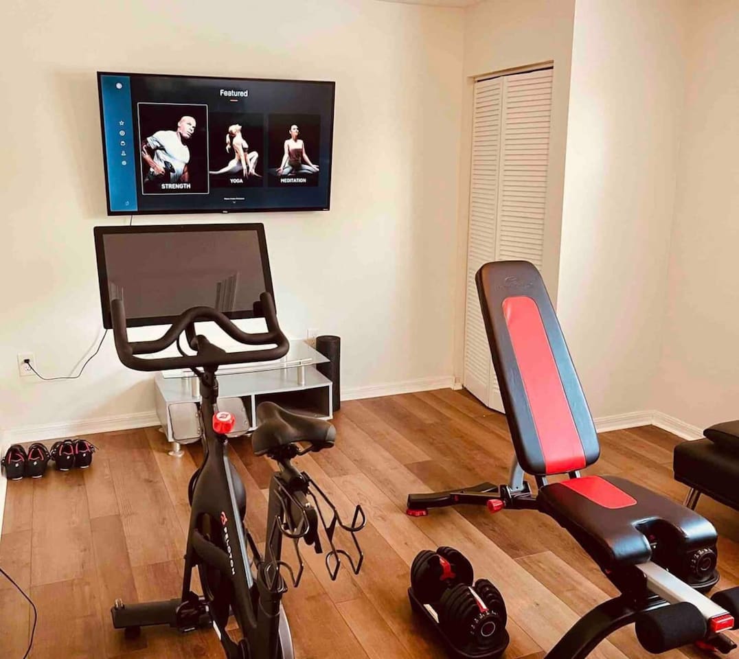 Peloton exercise bike, Bowflex 5-52 pound dumbbells and incline bench. 