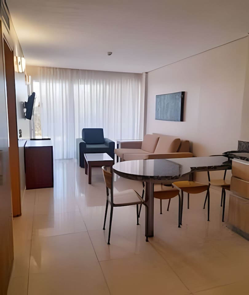 A spacious and bright living area perfect for relaxation or enjoying a meal.