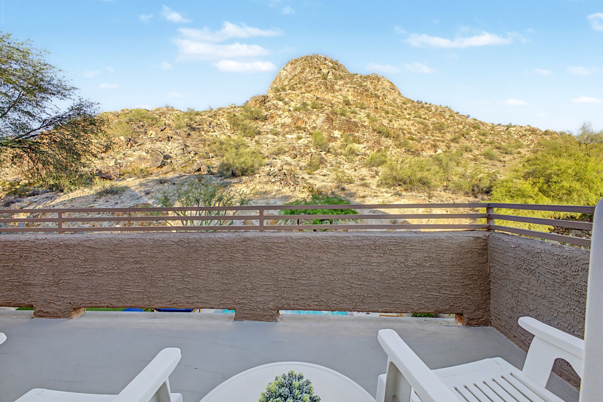 Primary Bedroom Outdoor Oasis: Sip your morning coffee with stunning mountain views from the private deck!