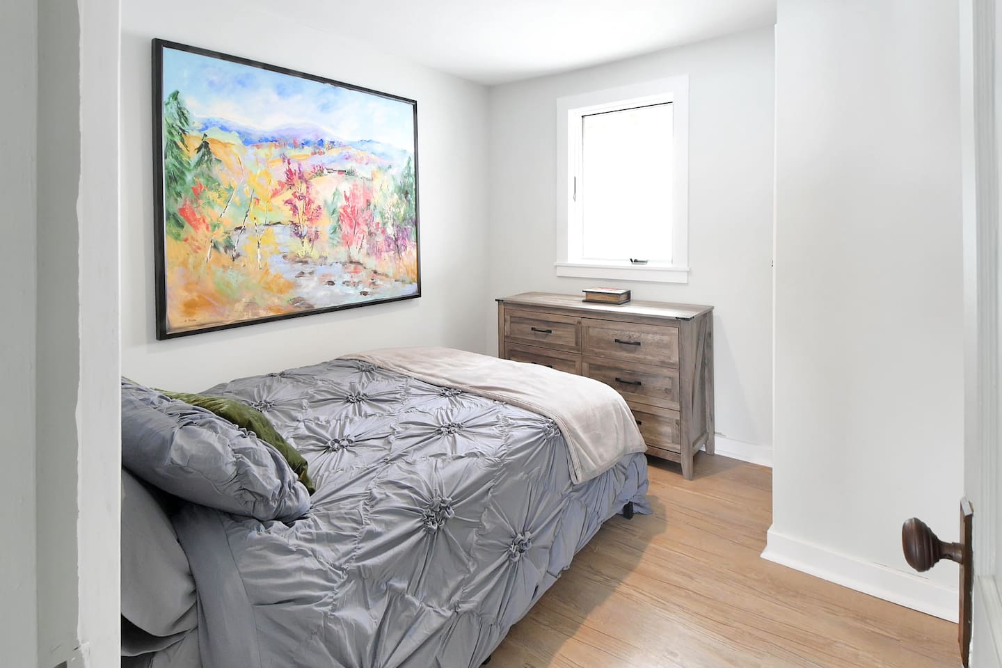 Bedroom 2 on the first floor of the home with double bed and tons of natural light