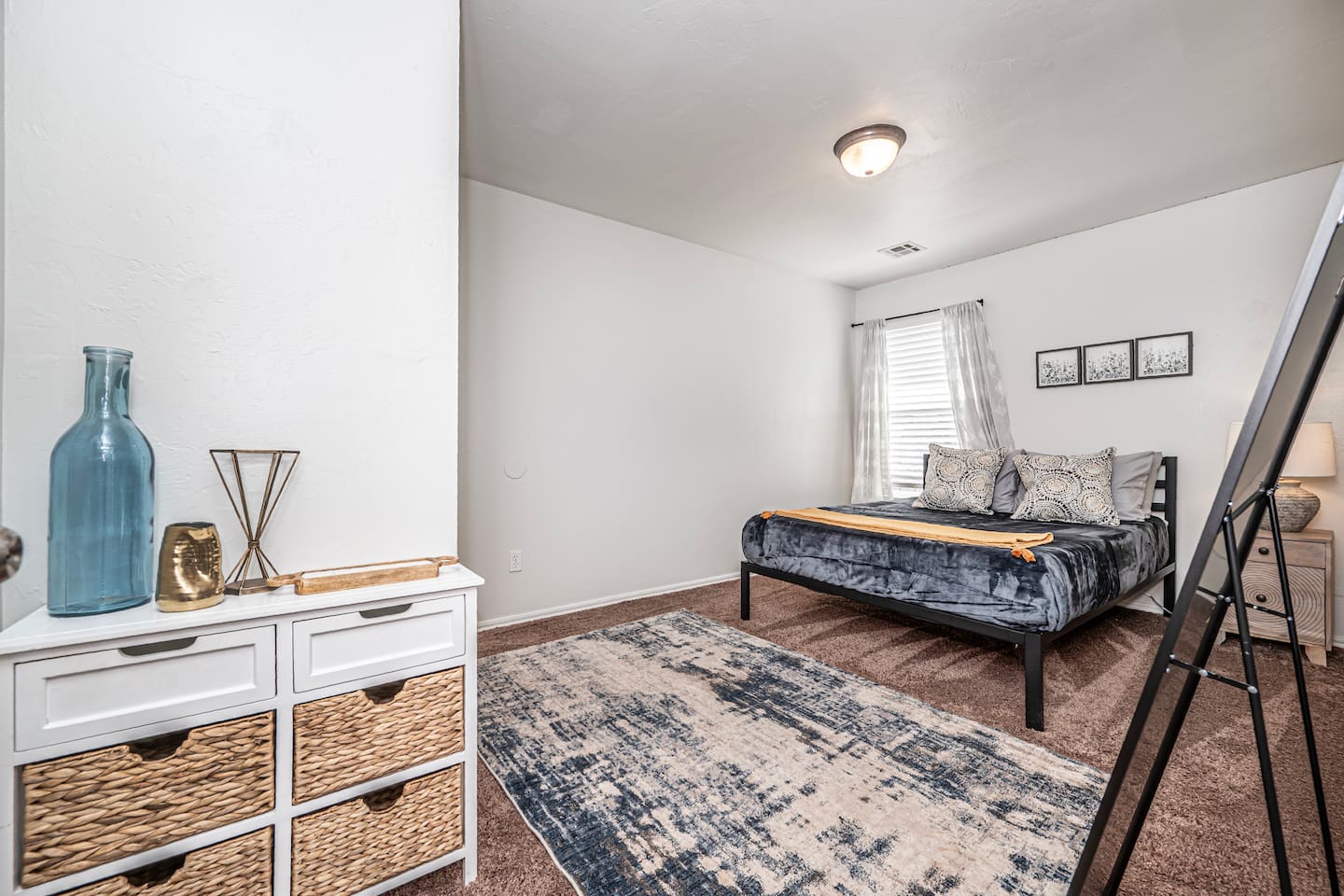 Relax in this stylish secondary bedroom with a comfortable queen bed.