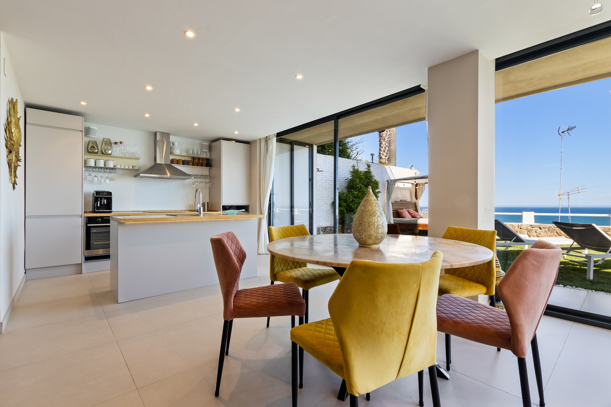 Dining space with natural light and sea-facing outlook