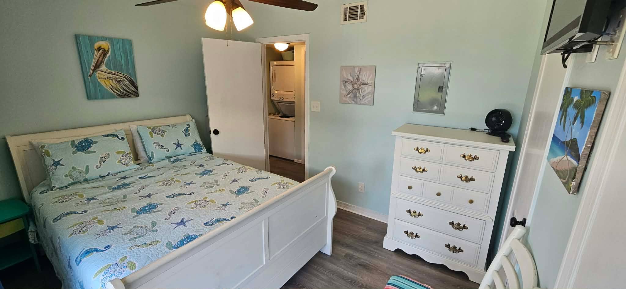 Bedroom 2. Queen size bed with dresser and closet