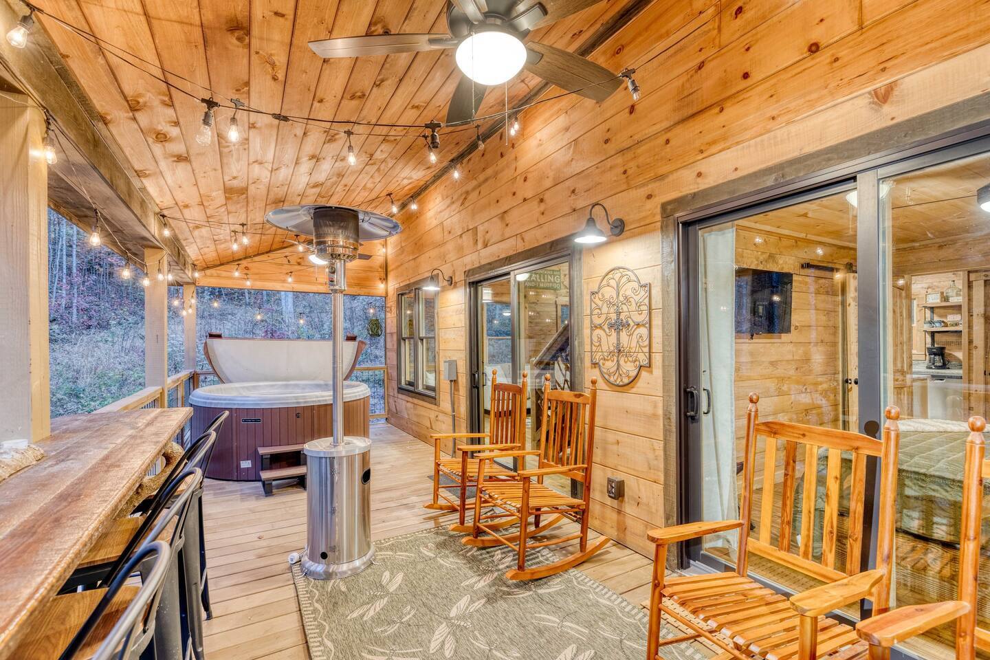 Step onto our welcoming porch adorned with a bubbling tub, a sizzling BBQ grill, and comfortable seating. Here, relaxation knows no bounds as you soak, grill, and unwind amidst the tranquil embrace of nature, creating unforgettable memories in our se