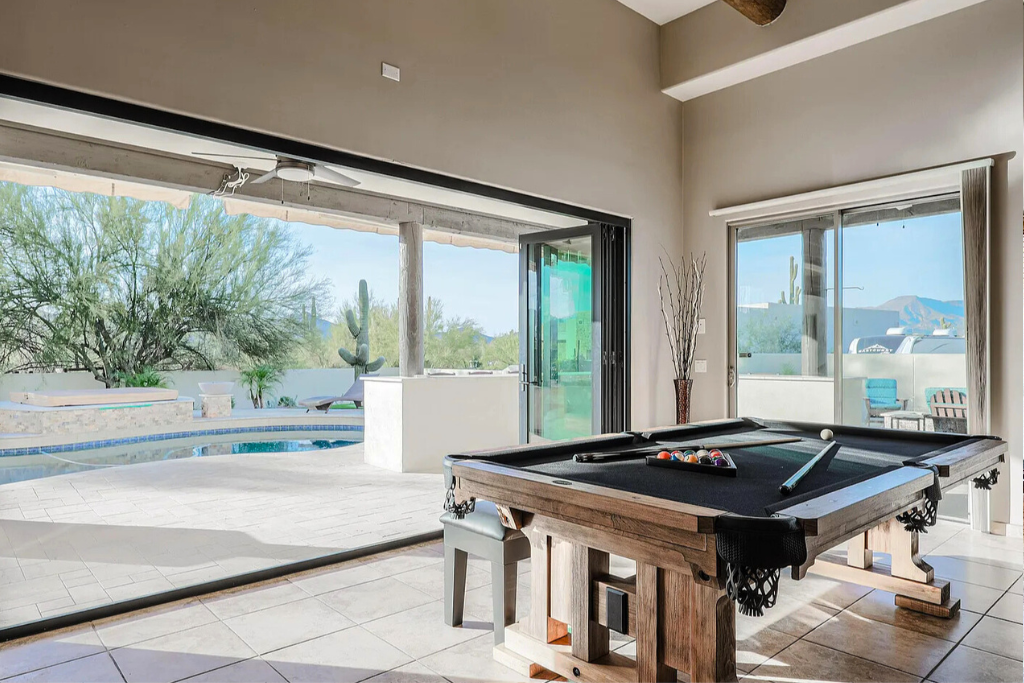 Indoor outdoor space.  Pool table converts to dining - perfect for gathering family and friends.