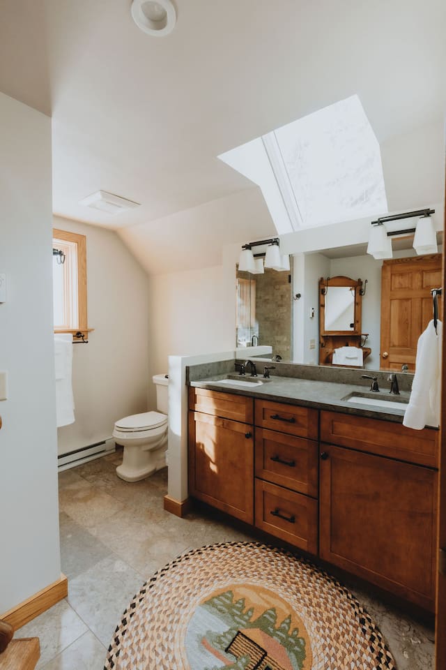 Bathroom 2 is on the upper level and is shared by Bedrooms 2 and 4