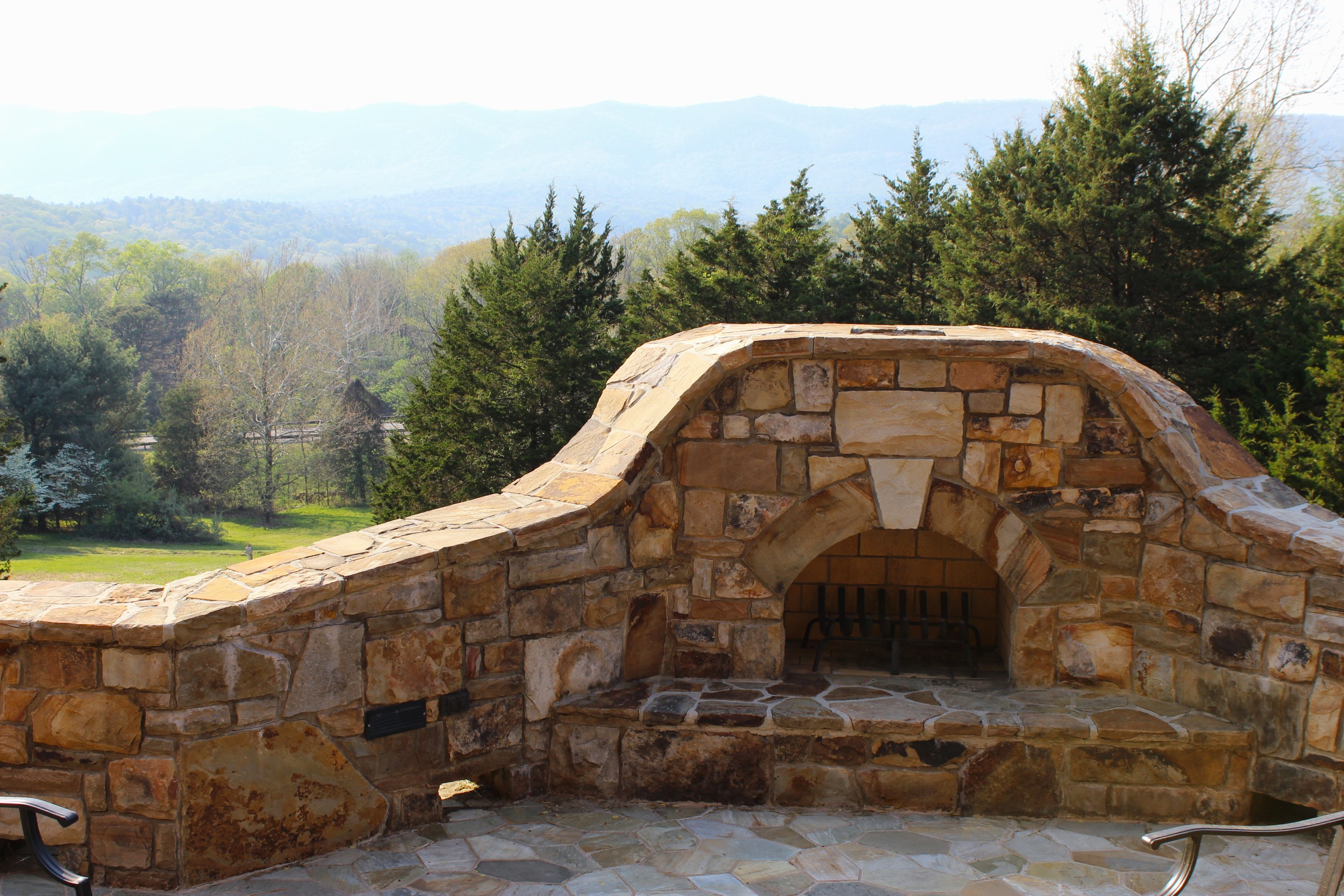 Fire pit on the patio surrounded by gorgeous mountain views.