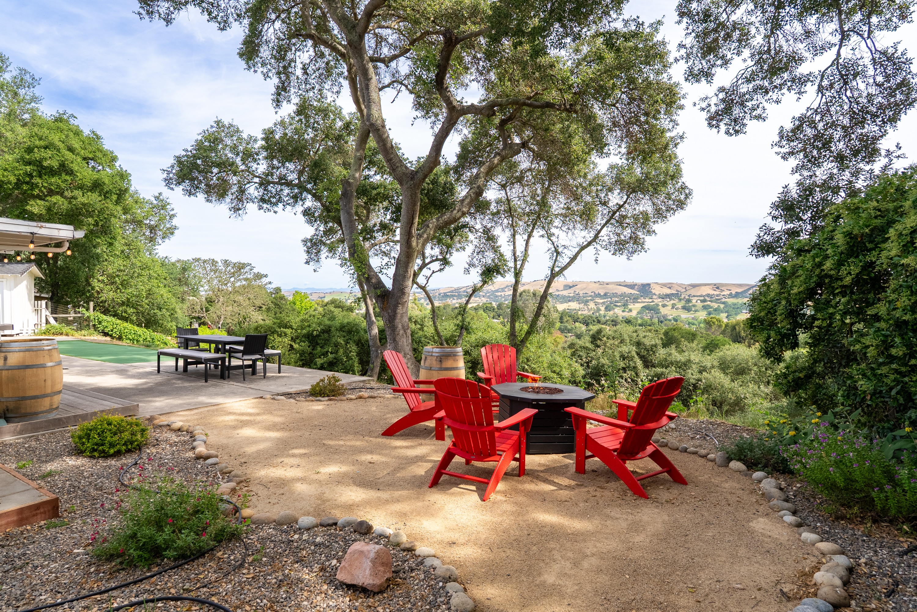 Unwind by the fire as the sun sets over the valley, the perfect end to a day in wine country.