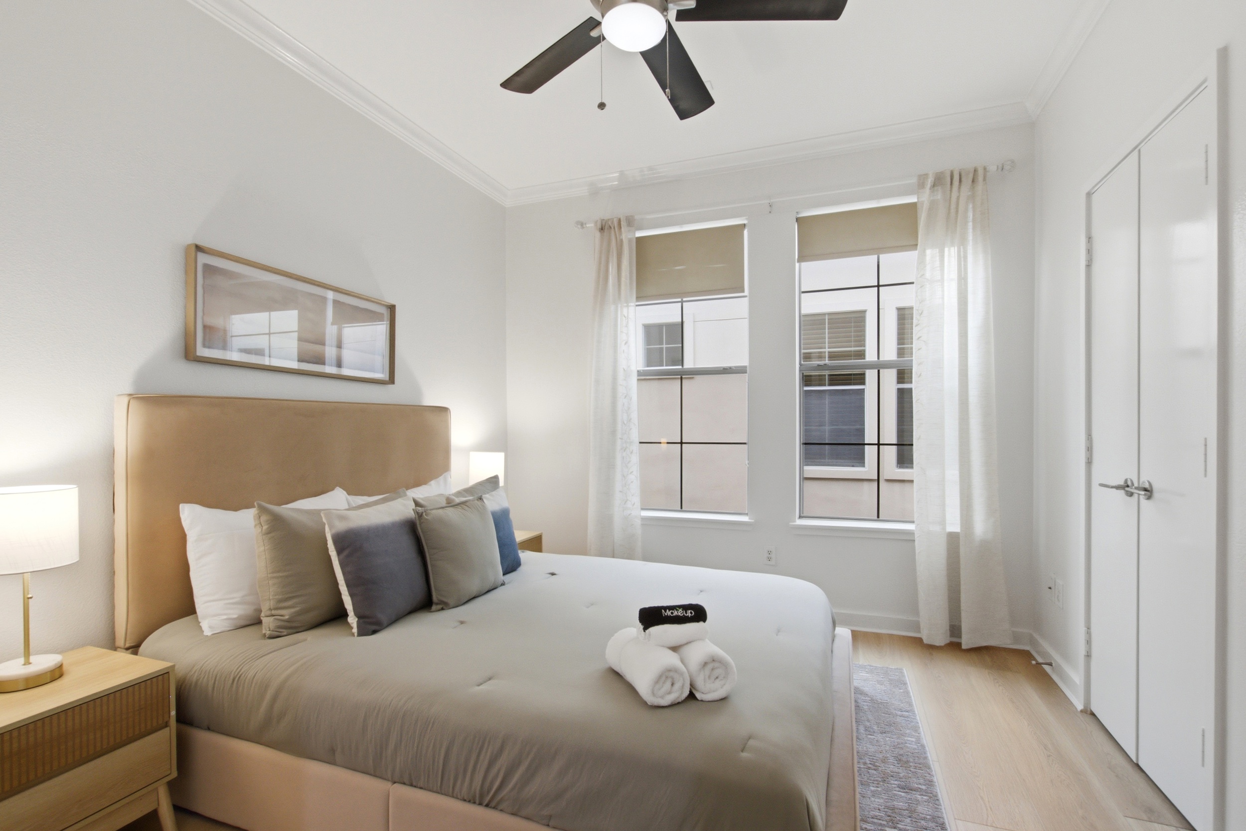 Relax in style with plush bedding and natural light streaming in!