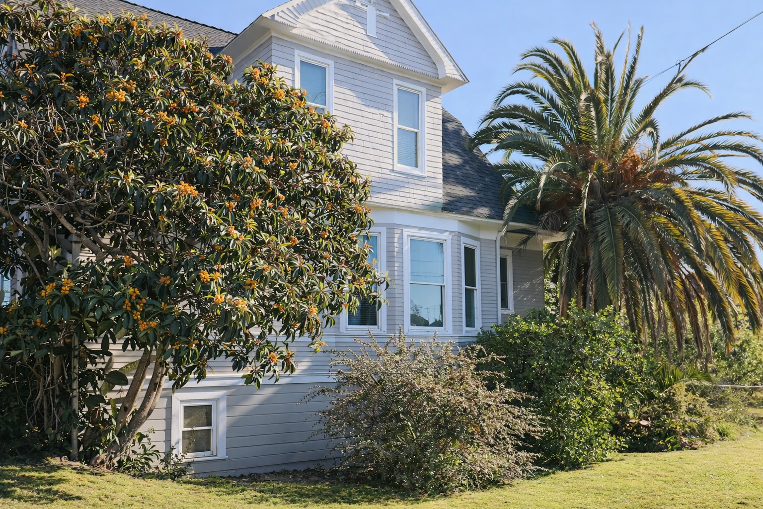 Welcome to your home away from home! Our charming Victorian-style cottage is framed by blooming trees and lush greenery, offering a peaceful retreat from the moment you arrive