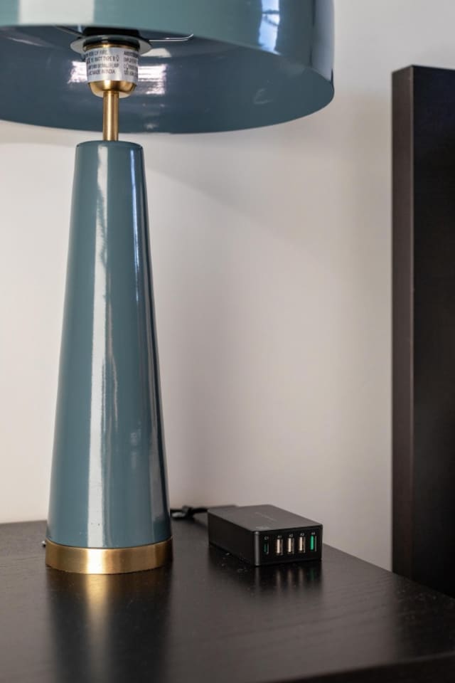 Sleek lamp with a multi-port USB charger.