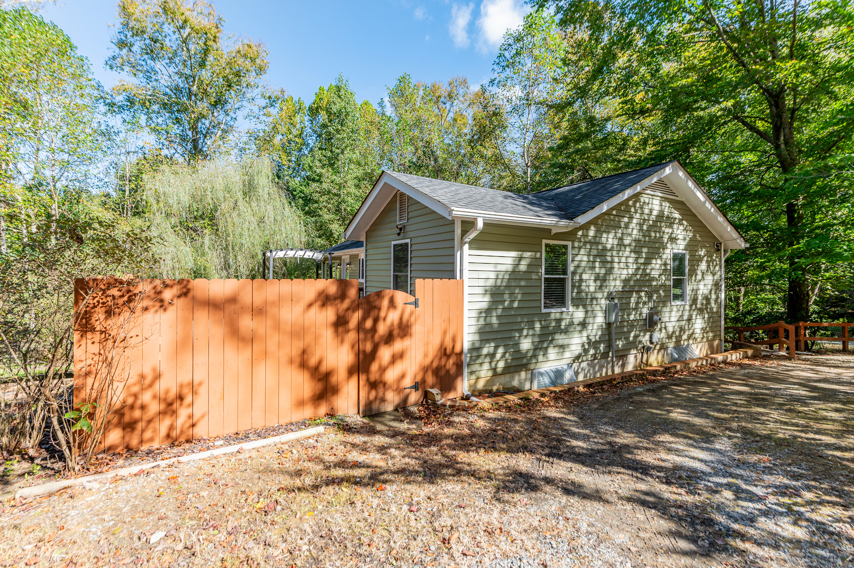 Entryway: Embrace nature in this charming home surrounded by lush greenery and tranquility!