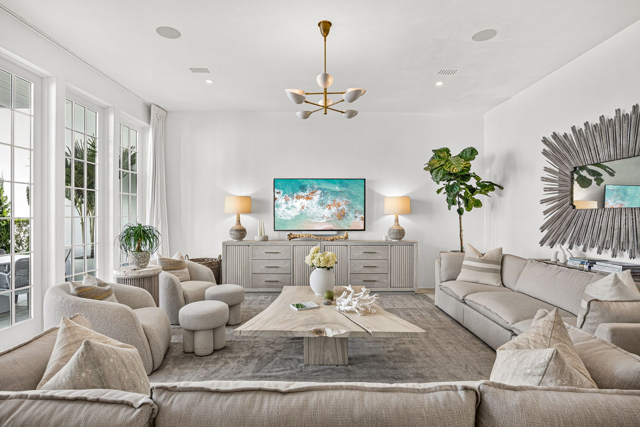 The stunning living room offers ample room for everyone to stretch out and relax.