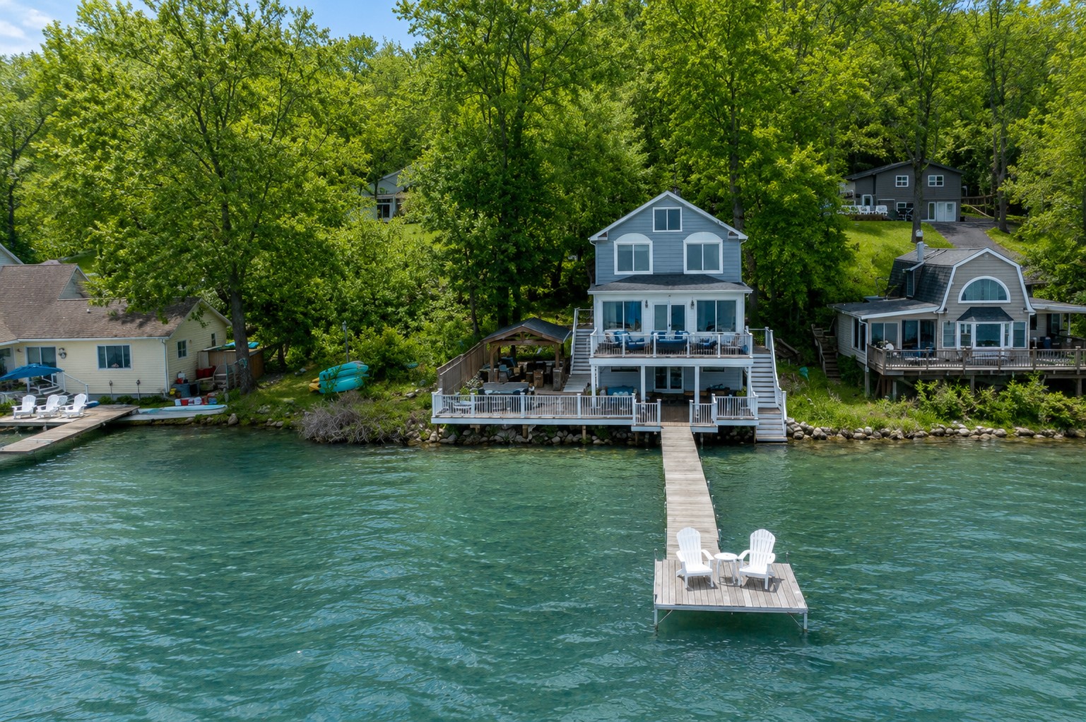 Stunning lakefront home with multi-level decks and a private dock—perfect for sunrise coffees and sunset cocktails 🌅🏡🚤