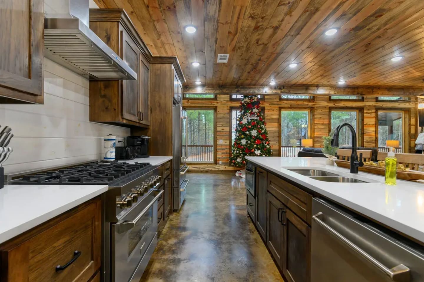 Stainless steel appliances, beautiful cabinetry, and a spacious island make cooking and conversation flow effortlessly.