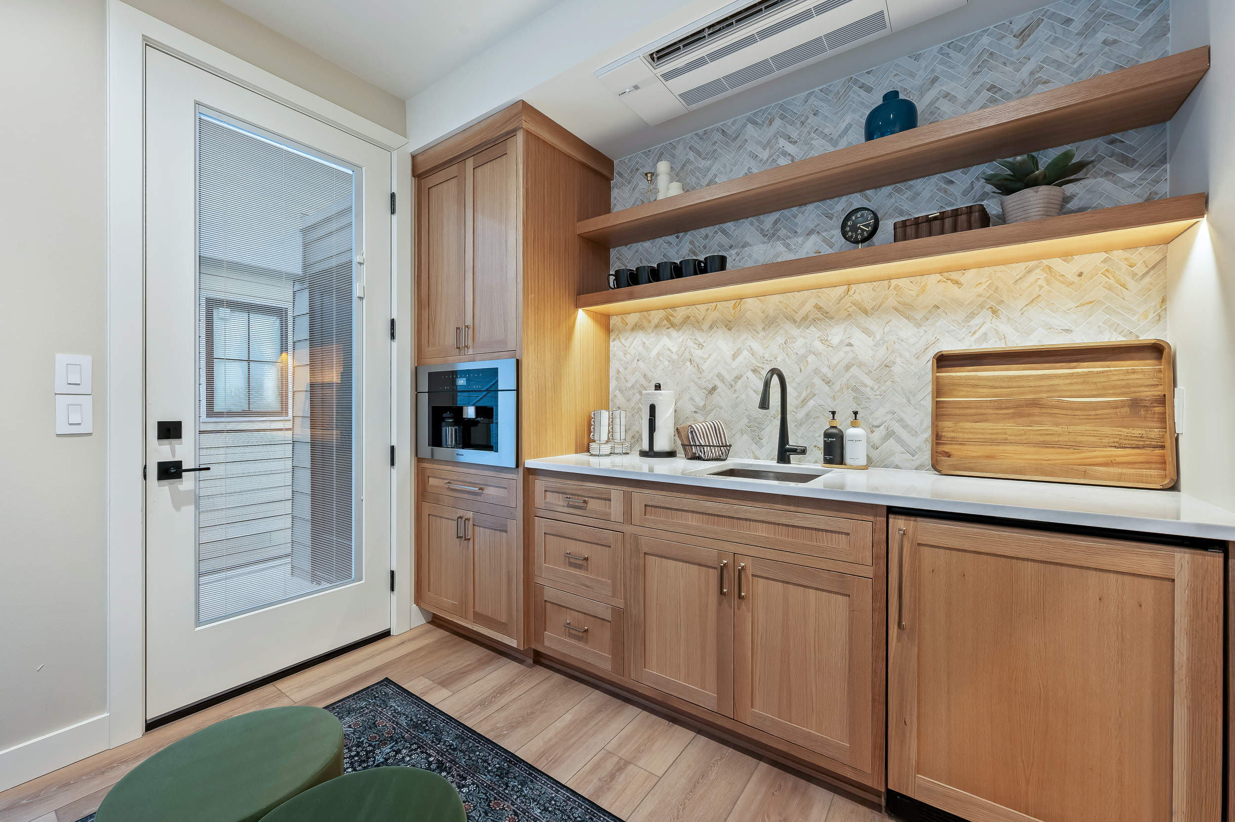 Upstairs lounge and coffee bar area with Miele espresso maker and mini fridge