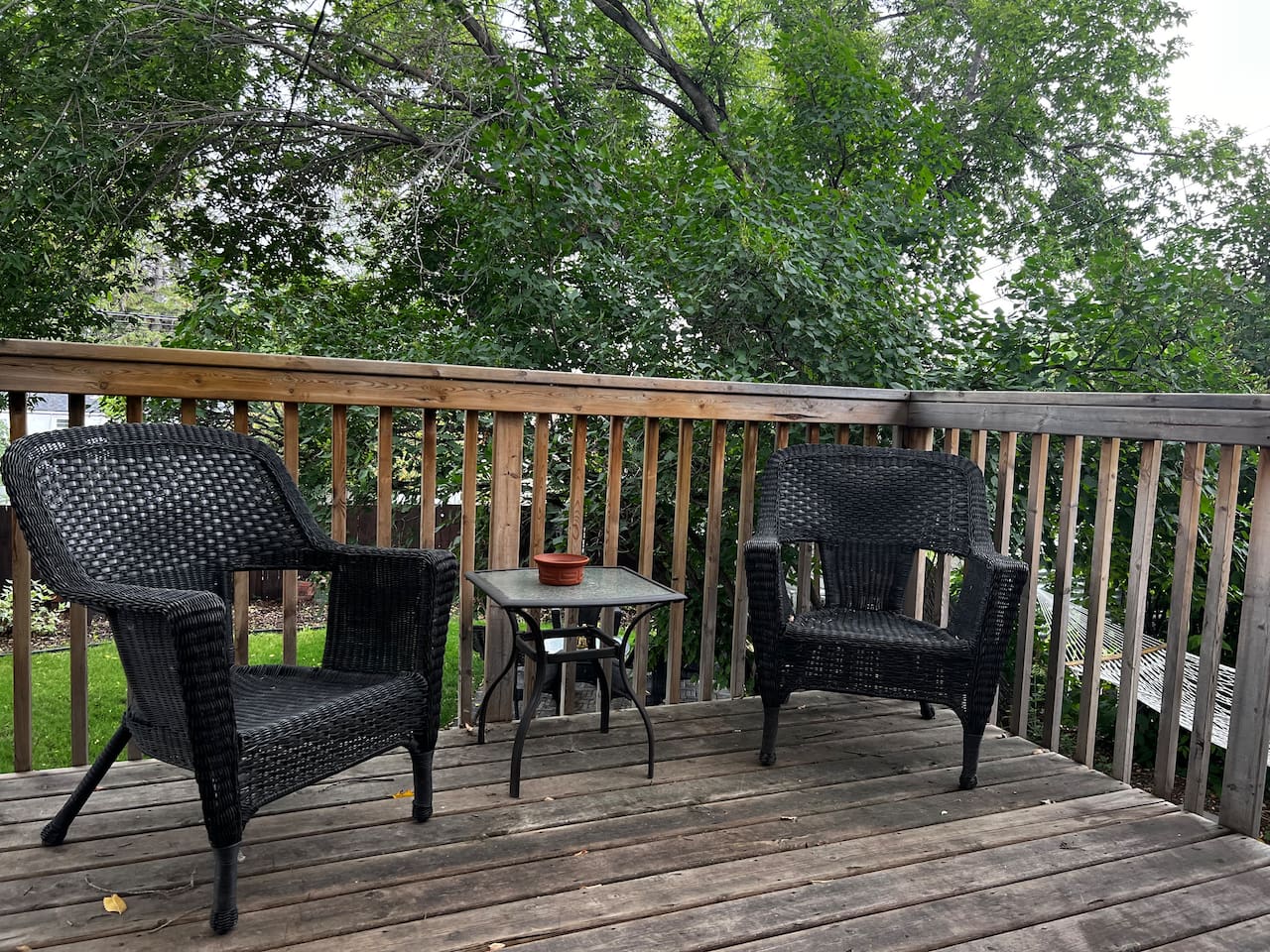 Two-seat deck setup for morning coffee or quiet evenings