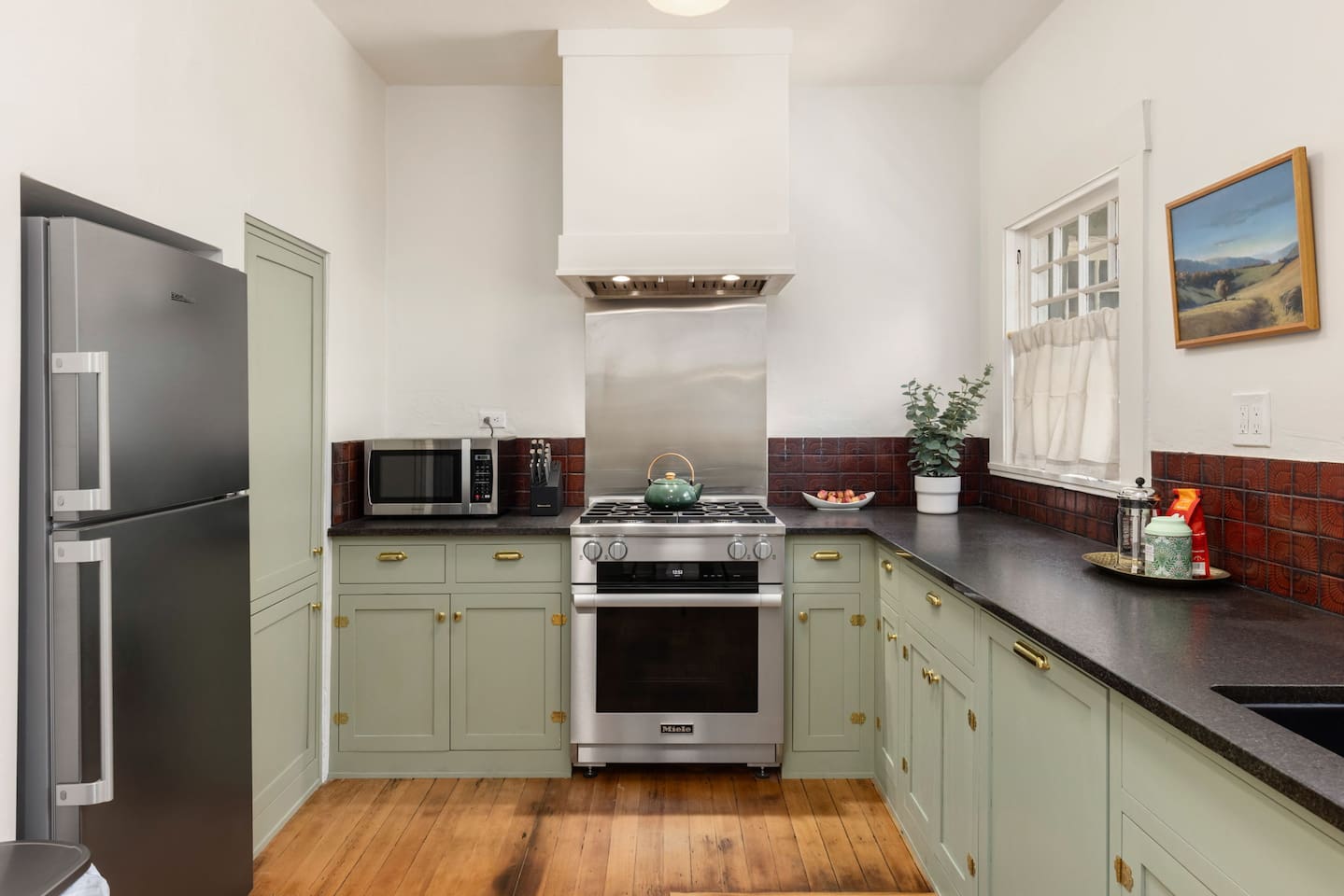 new kitchen cabinets, new appliances with vintage feel. Miele stove and dishwasher