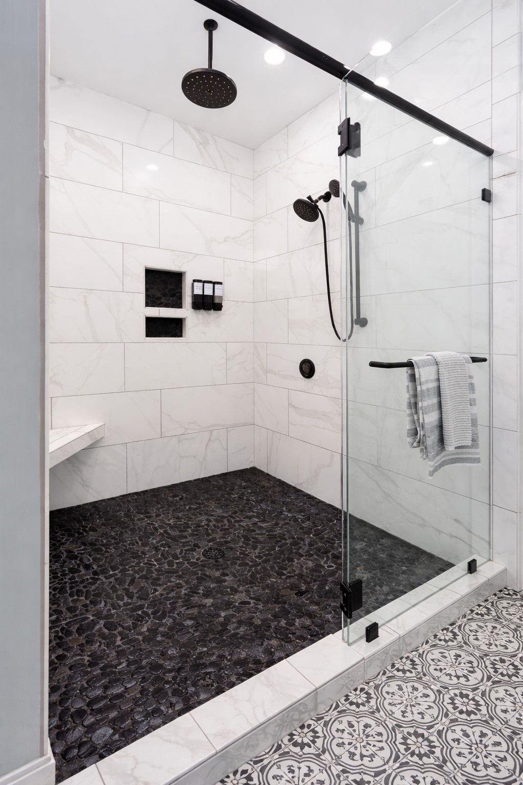Walk-in shower with striking tile details and spa-inspired finishes.
