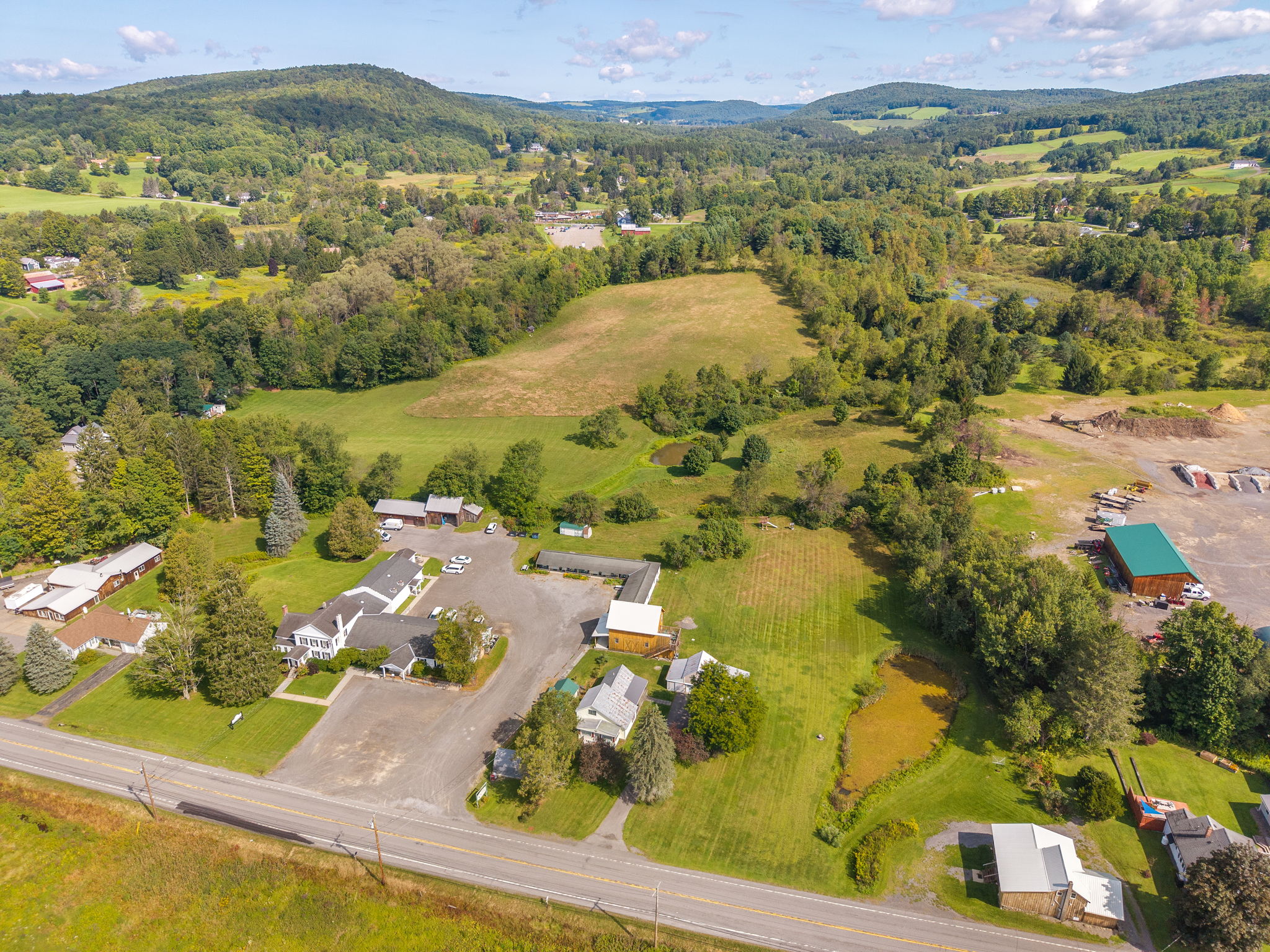 A sweeping view of the grounds and surrounding Fly Creek landscape.