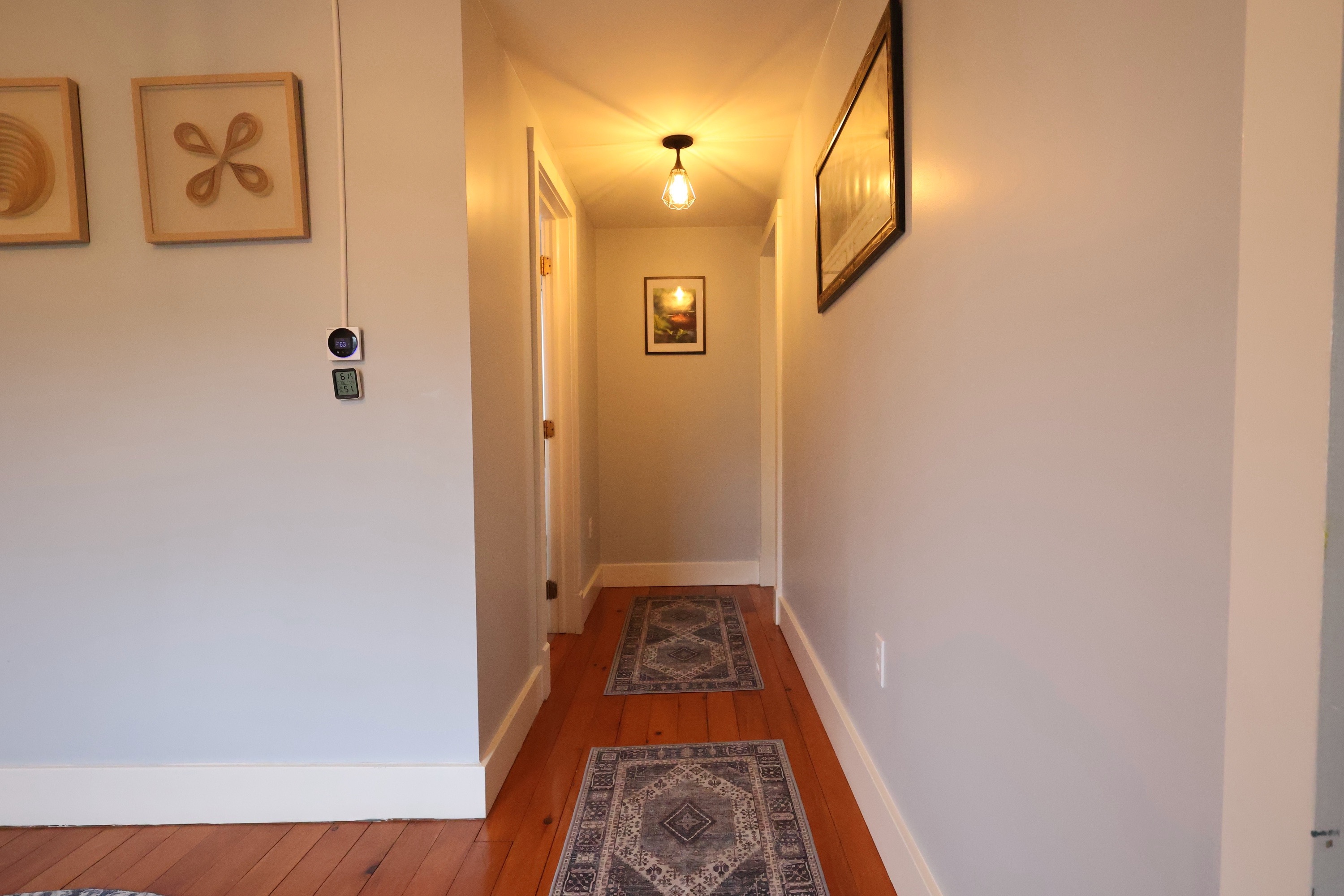 Hallway leading to a bedroom and a shared bath