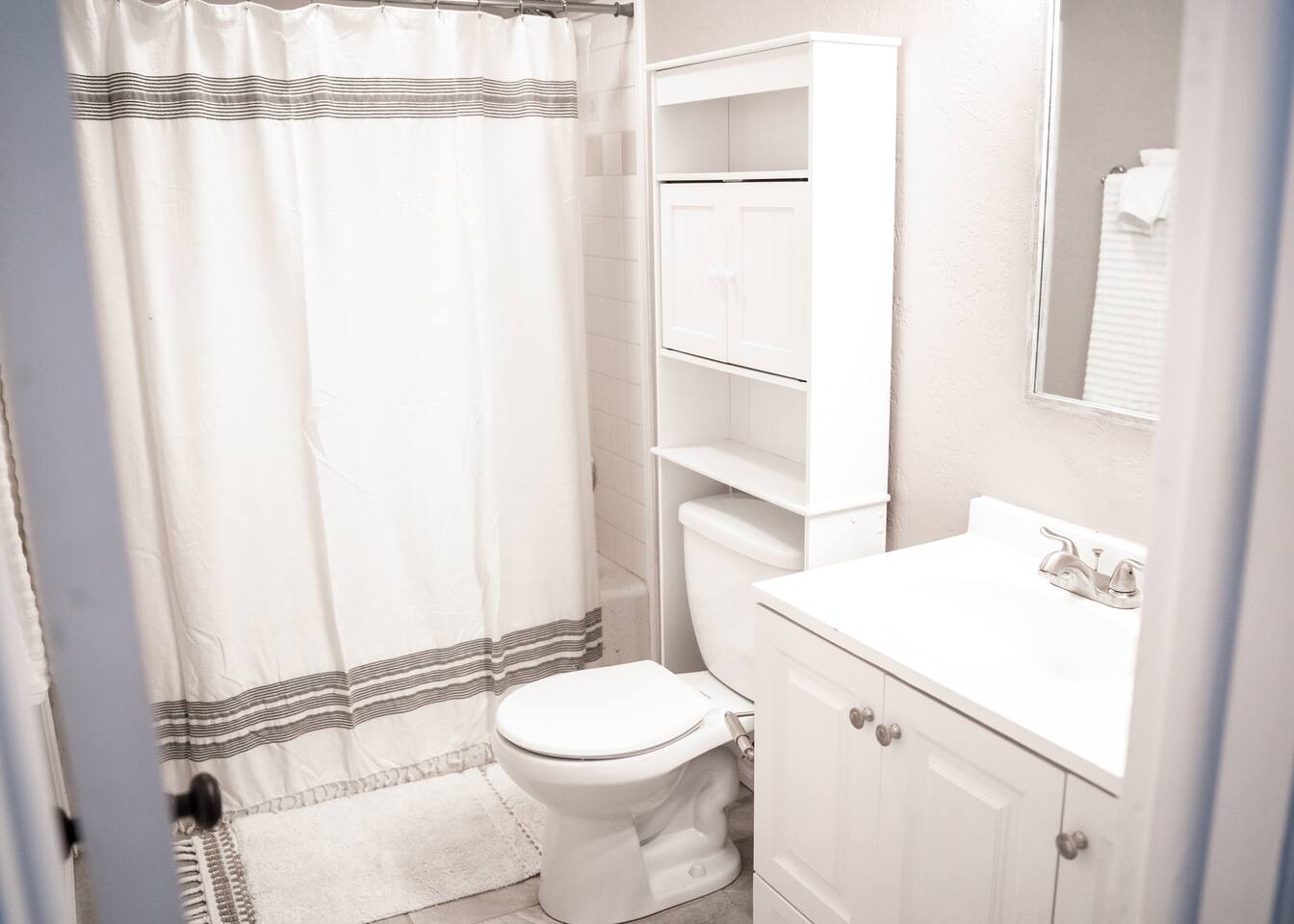 Enjoy the flexibility of a shower or bath in this full bathroom.