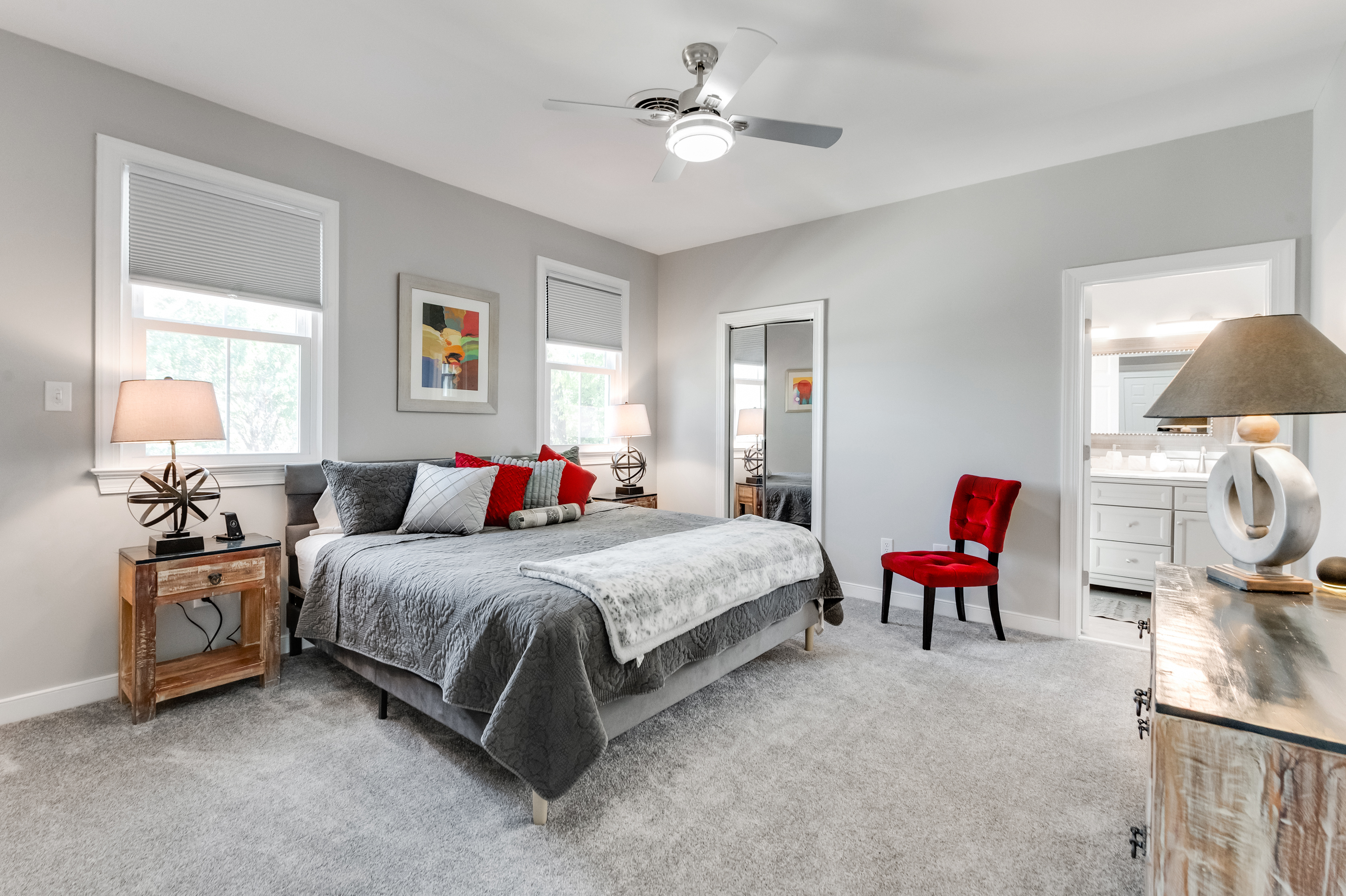 King Bedroom 1: Relax in style with bright light, plush bedding, and vibrant accents!