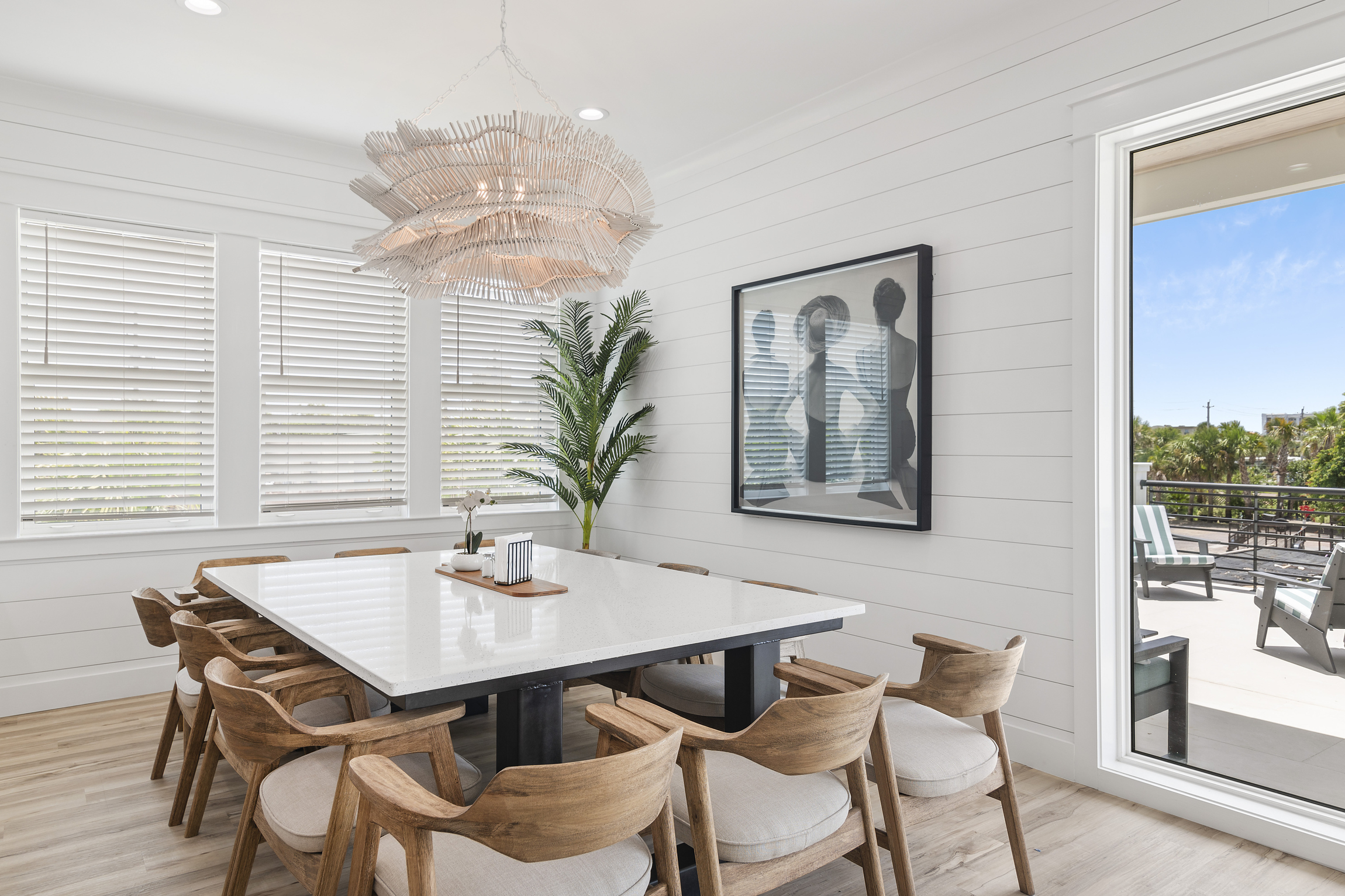Enjoy a stylish dining space with modern art and beautiful lighting.
