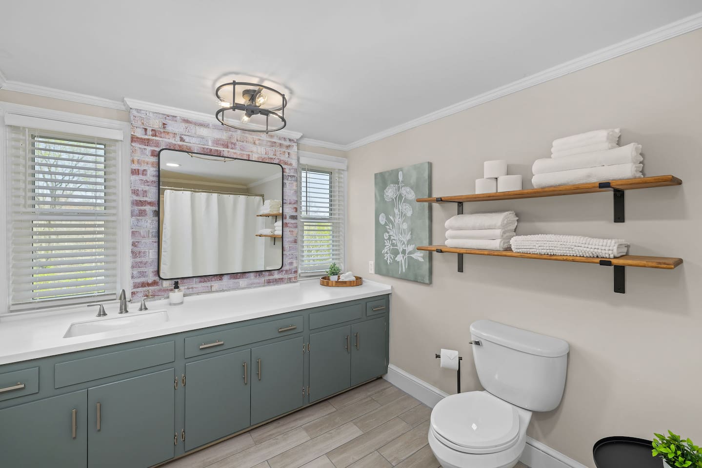 Spacious full bathroom in the Oak Canopy Suite includes sink, toilet, and tub/shower combo