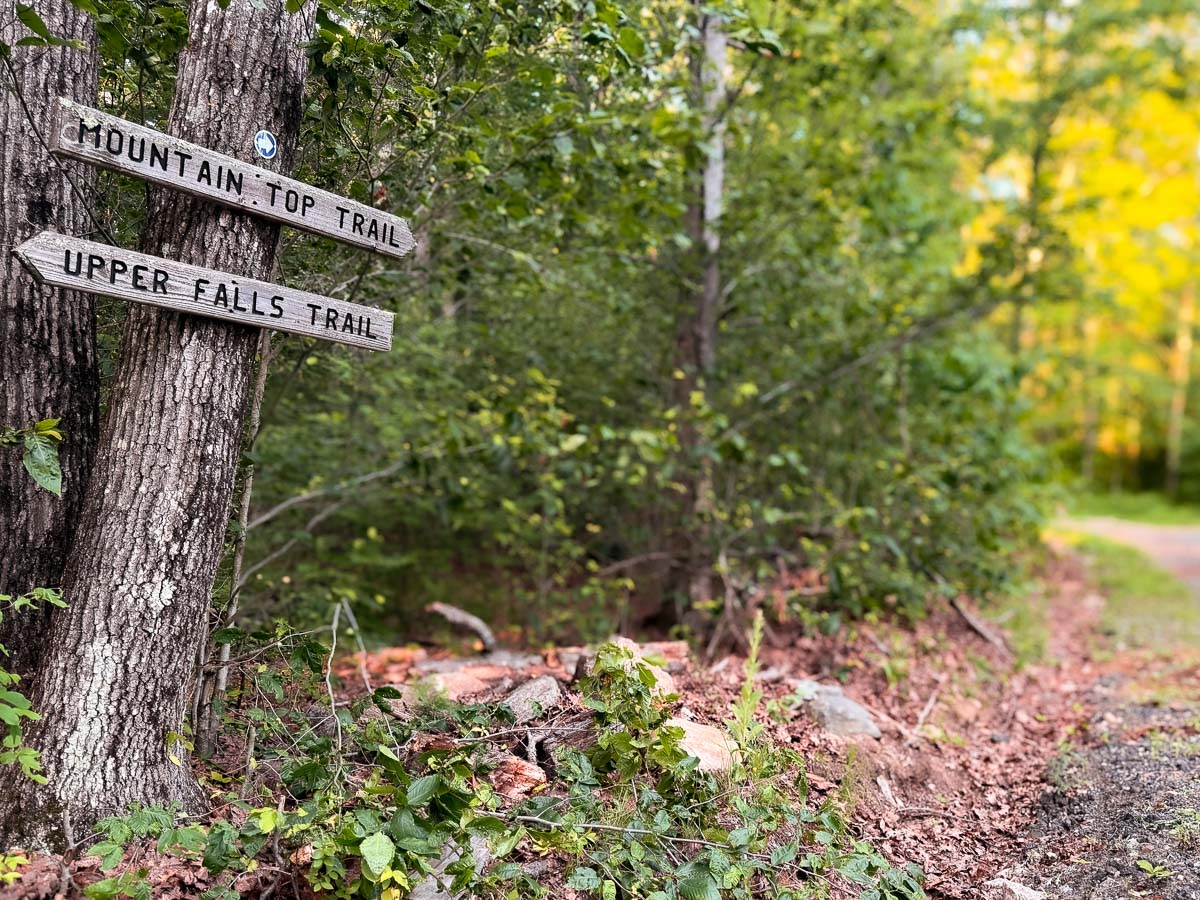Hand-cut Mountain Top and Upper Falls trail signpost on Woodruff Mountain &mdash; Sunset Falls Estate