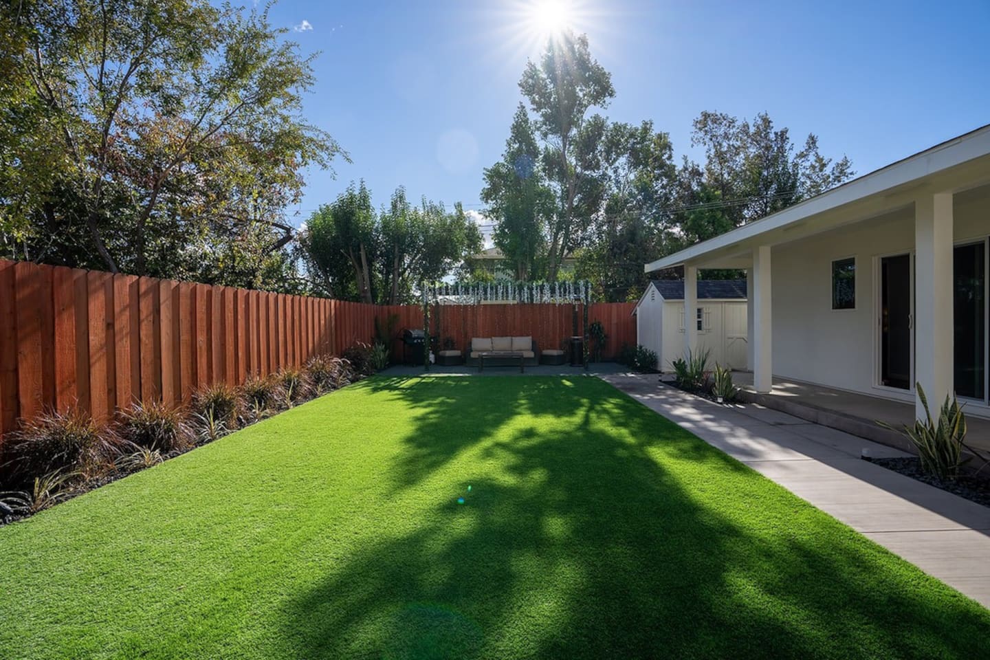 Enjoy the day or night in our spacious backyard