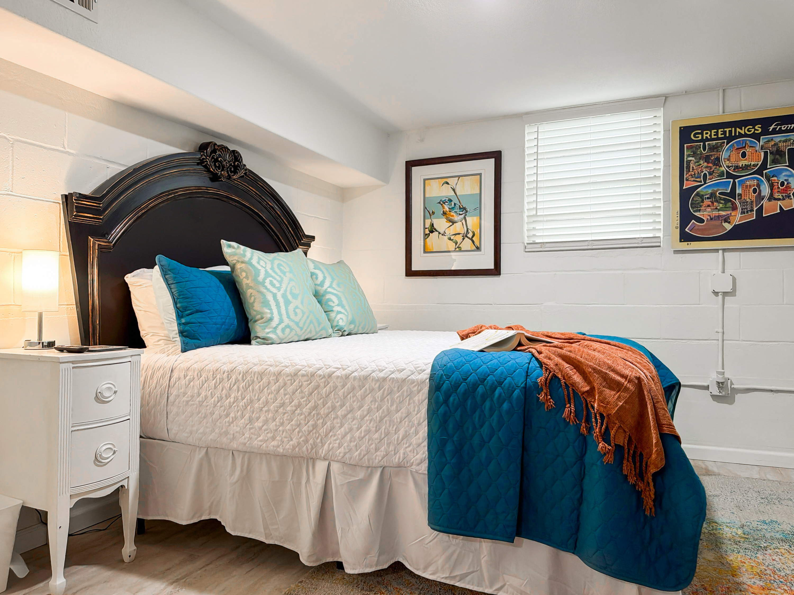 Take the downstairs room for a quiet night's sleep — tucked away for whoever wants to turn in early.