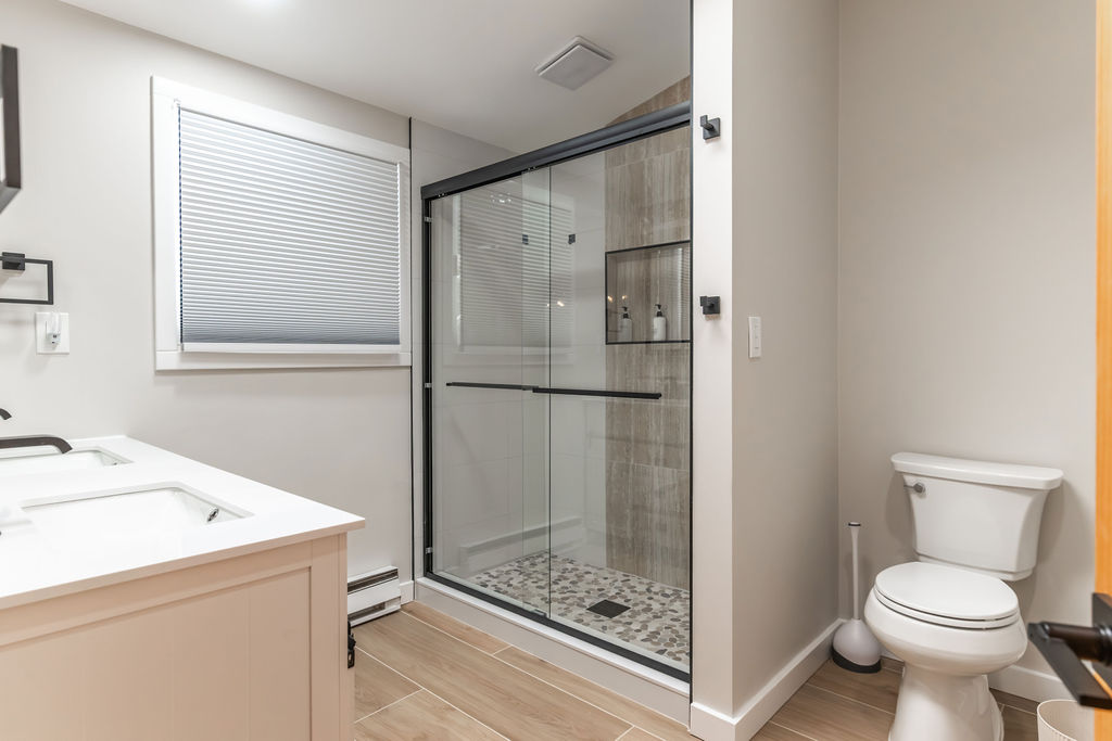 Ensuite Bathroom with a dual vanity and a glass door shower attached to the master bedroom! Shampoo, Conditioner and Body Wash included!