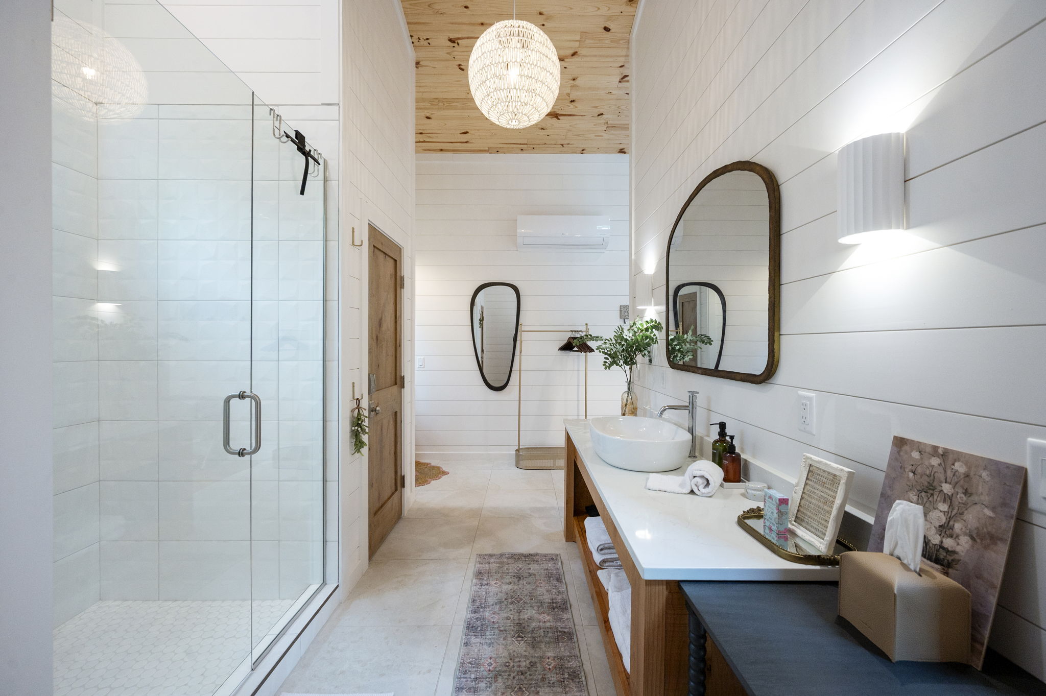 The private casita ensuite bathroom offers a luxurious, spa-like experience with premium finishes, warm design touches, and complete privacy—creating the perfect place to relax and recharge.