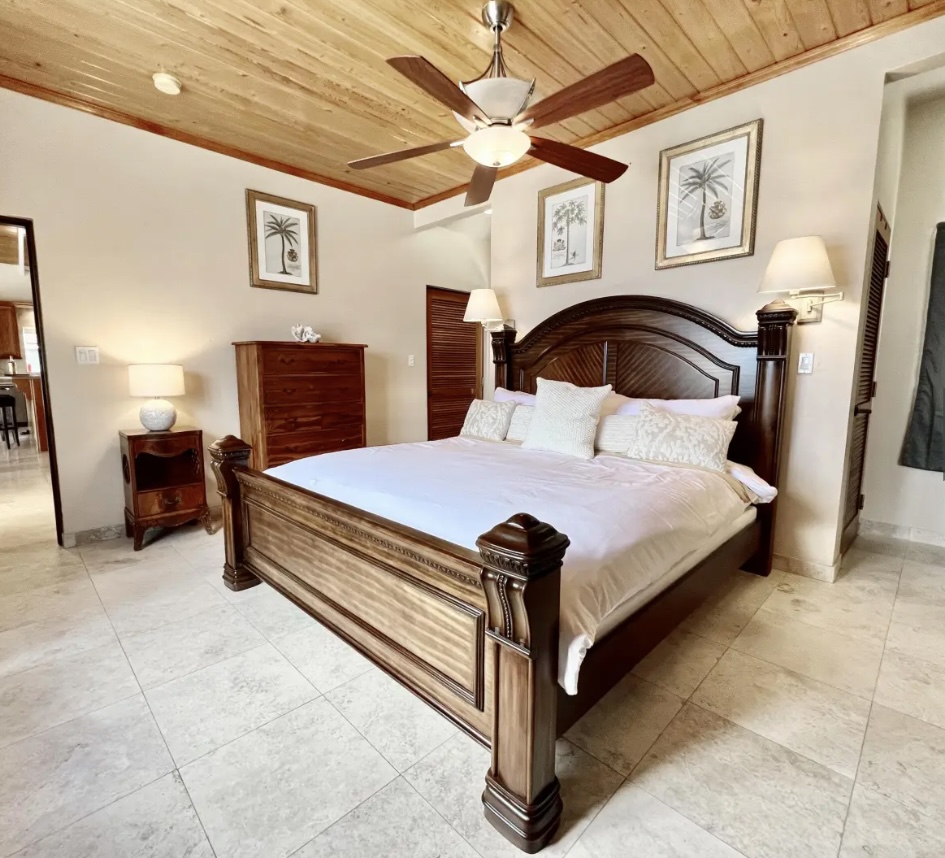 Relax in the king primary suite with elegant furnishings and calming Caribbean style.