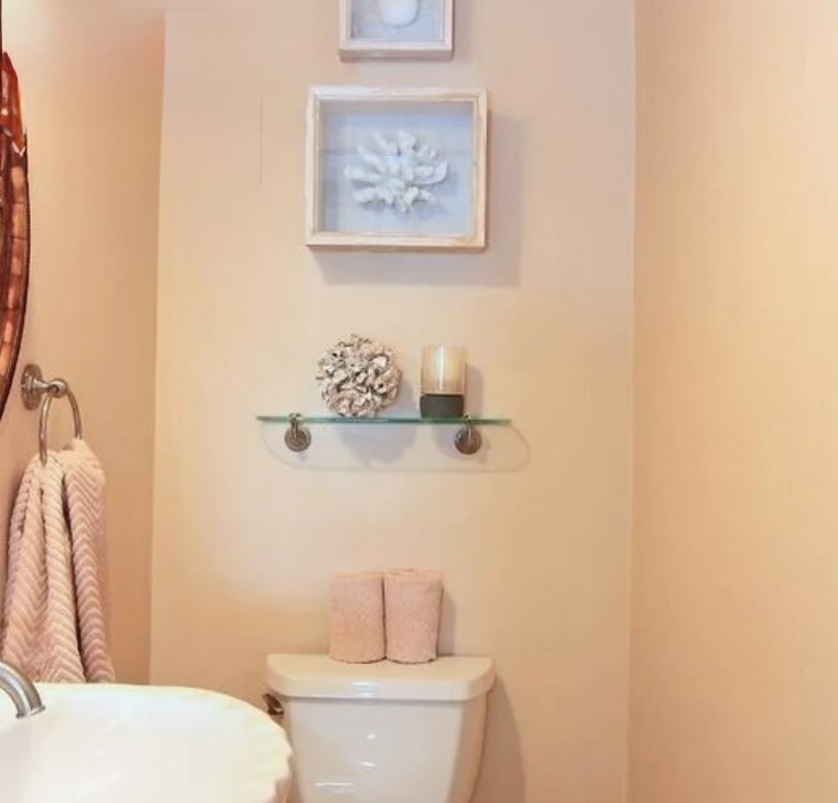 Clean, airy bath with walk-in shower and coastal details—fresh, simple, and comfortable.